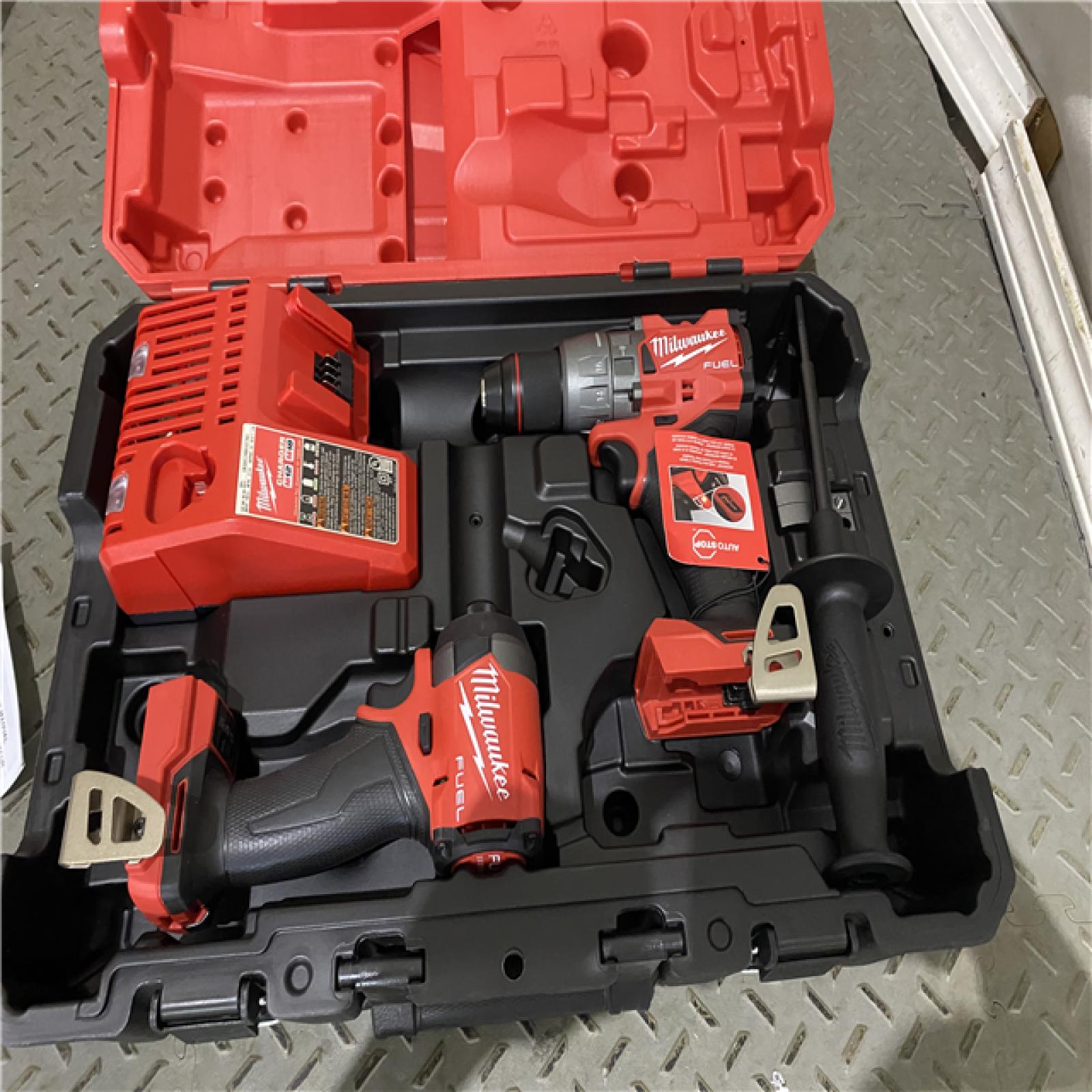 Houston location AS-IS Milwaukee 3697-22 M18 FUEL 1/2 Hammer Driller/Driver &1/4 Hex Impact Driver 2 Tool Combo  MISSING BATTERYS