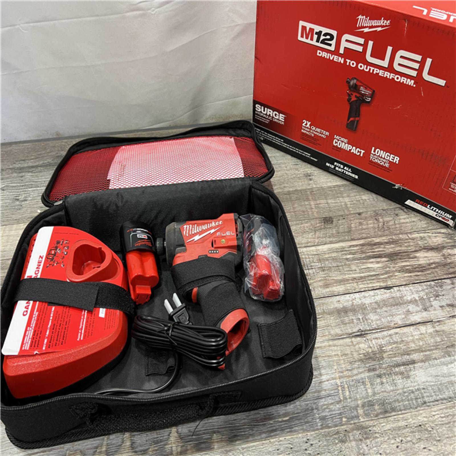 AS-IS MILWAUKEE M12 FUEL SURGE 12V Lithium-Ion Brushless Cordless 1/4 in. Hex Impact Driver Compact Kit W/Two 2.0Ah Batteries, Bag