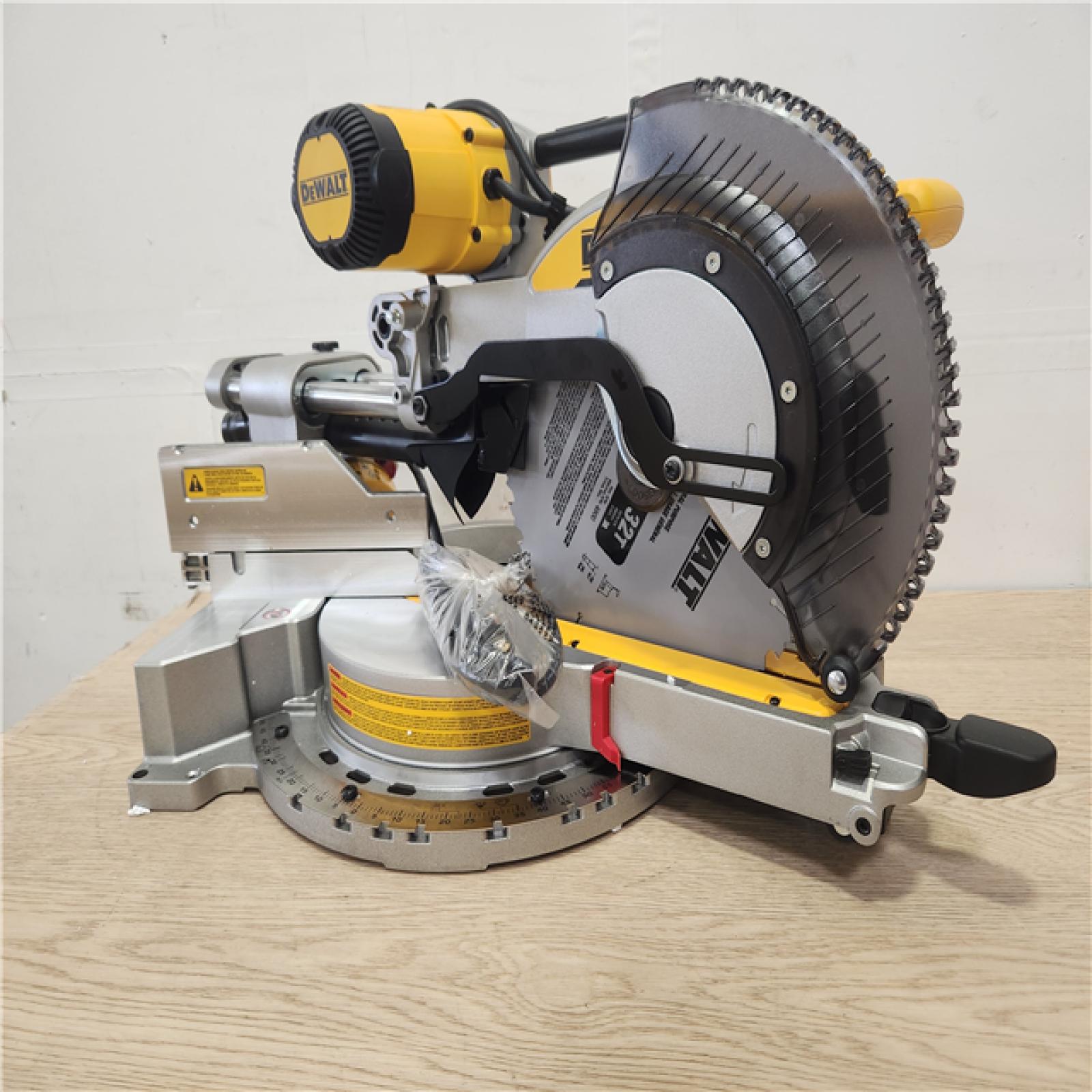 Phoenix Location Appears NEW DEWALT 15 Amp Corded 12 in. Double Bevel Sliding Compound Miter Saw, Blade Wrench and Material Clamp DWS779