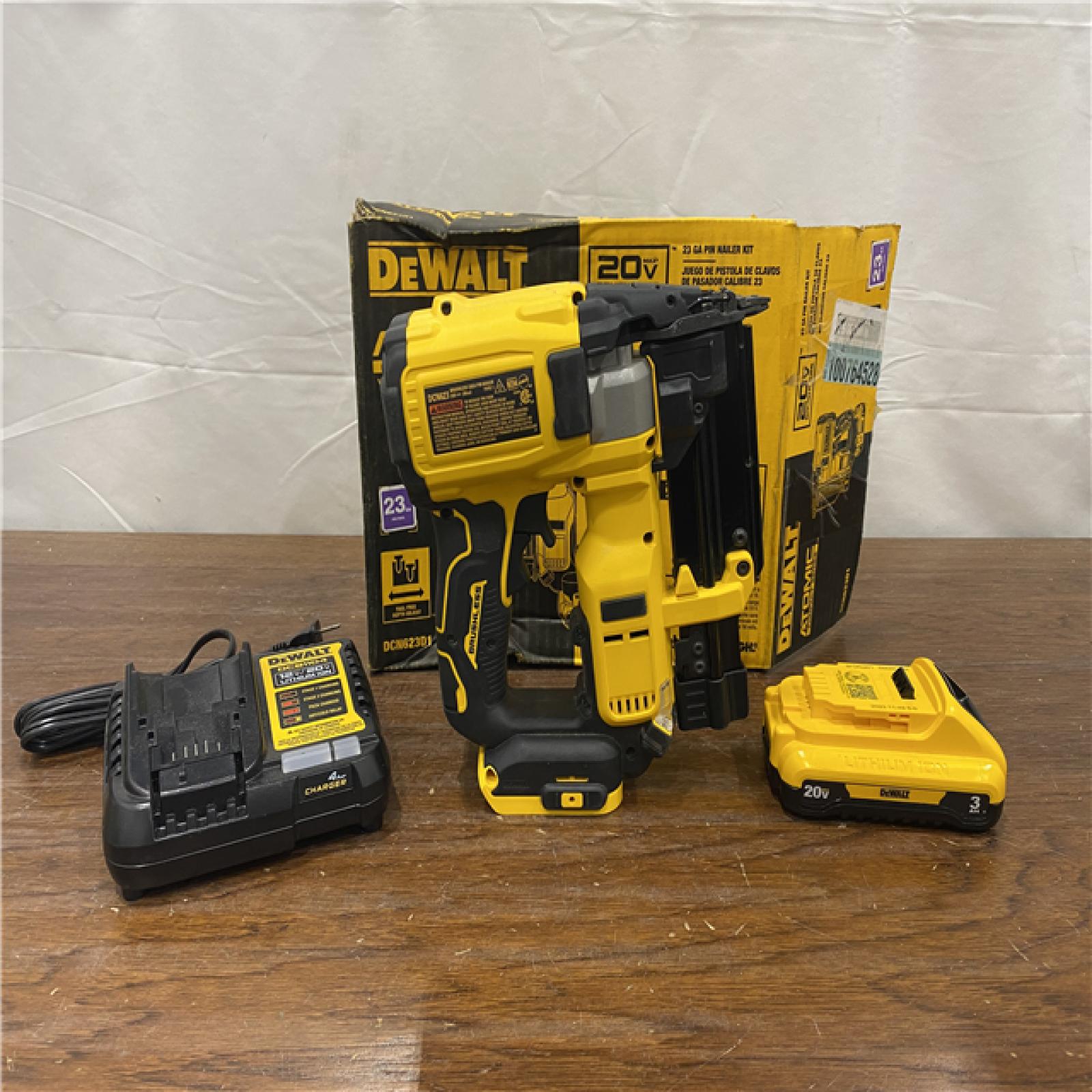 AS-IS DEWALT ATOMIC 20V MAX Lithium Ion Cordless 23 Gauge Pin Nailer Kit with 3.0Ah Battery and Charger