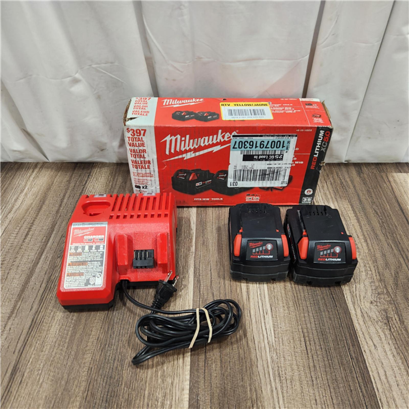 AS IS M18 18-Volt Lithium-Ion XC Starter Kit with Two 5.0Ah Batteries and Charger