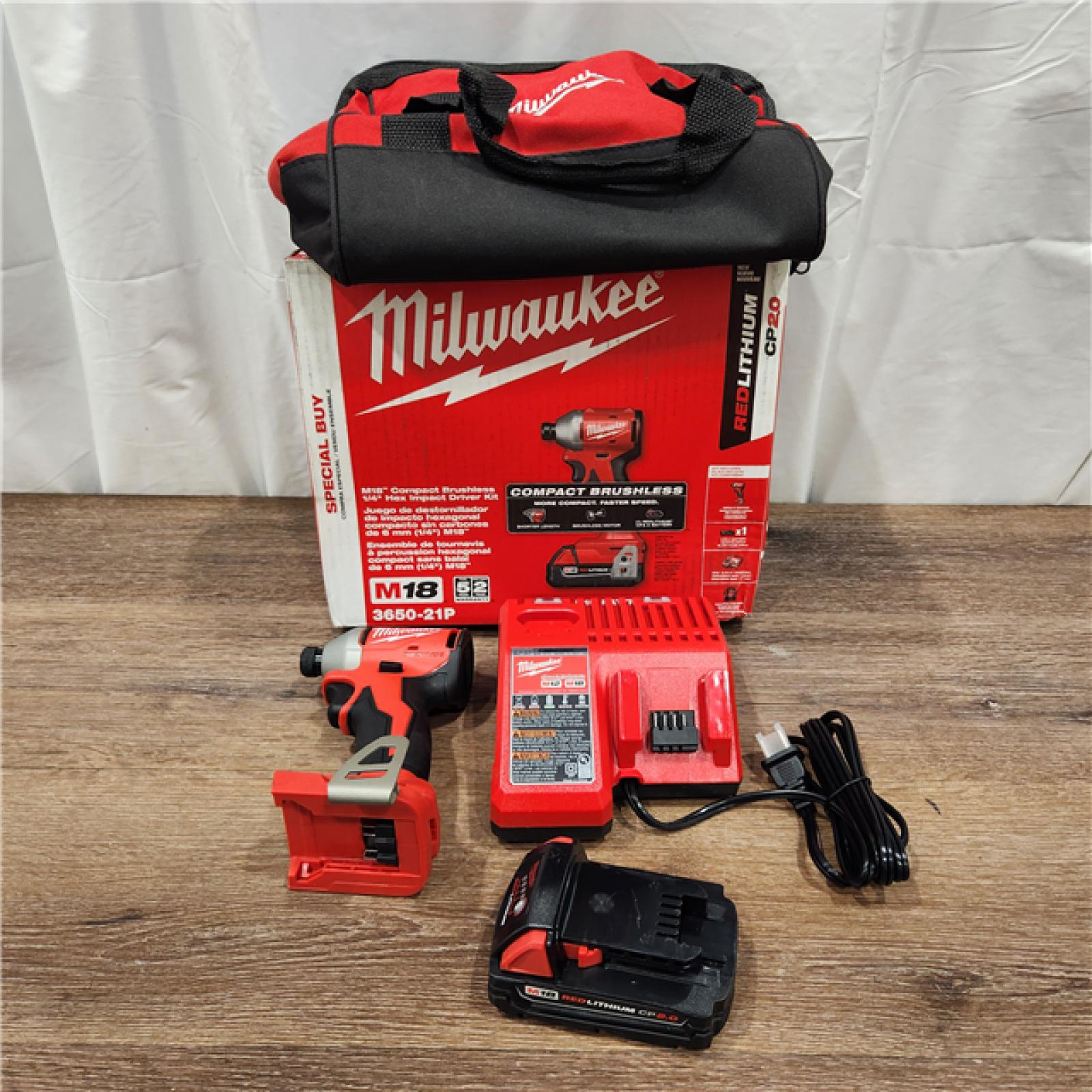 AS-IS M18 18-Volt Lithium-Ion Compact Brushless Cordless 1/4 in. Impact Driver Kit with One 2.0 Ah Battery, Charger & Tool Bag