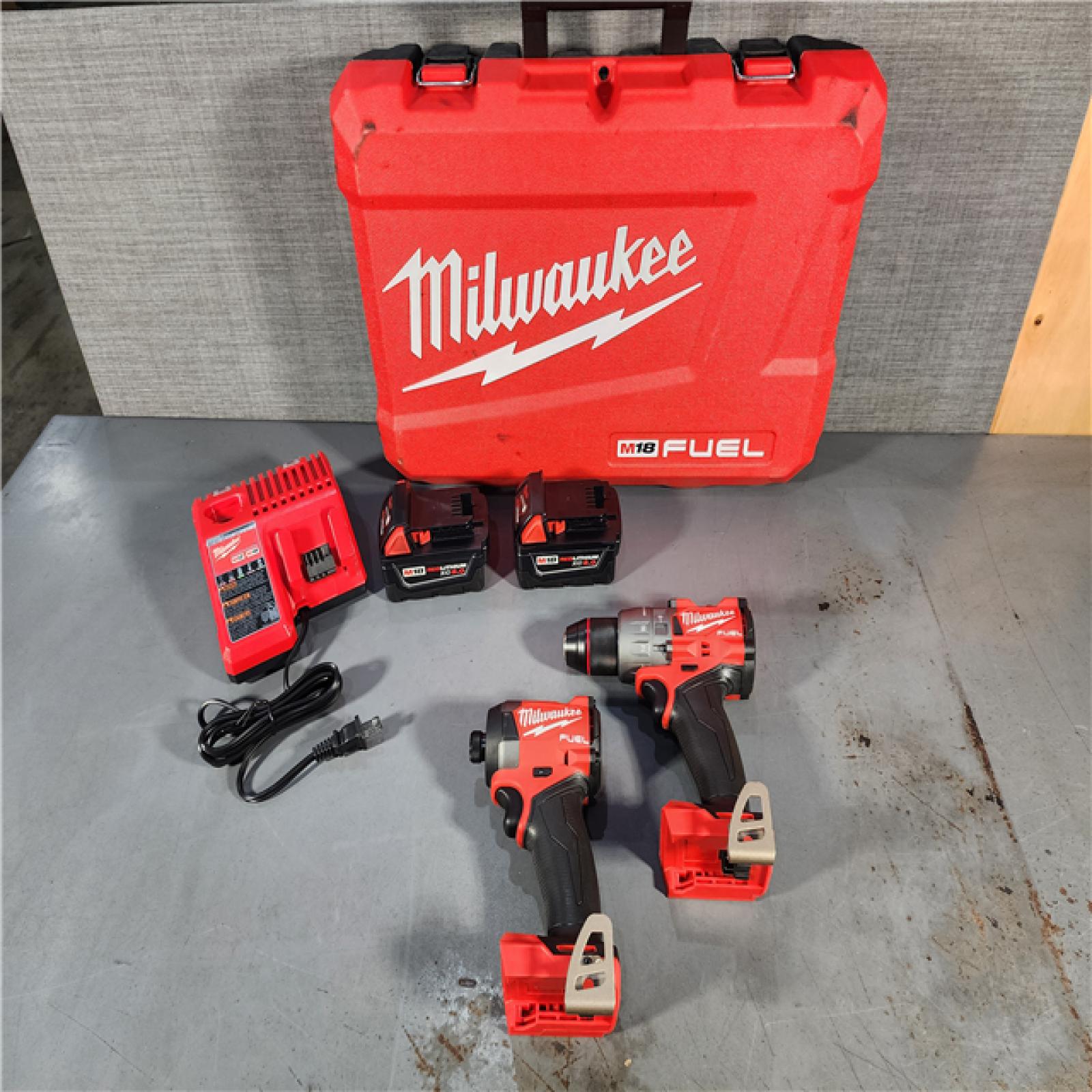 HOUSTON LOCATION - AS-IS (APPEARS LIKE NEW) Milwaukee M18 FUEL 18V Lithium-Ion Brushless Cordless Hammer Drill and Impact Driver Combo Kit (2-Tool) with 2 Batteries