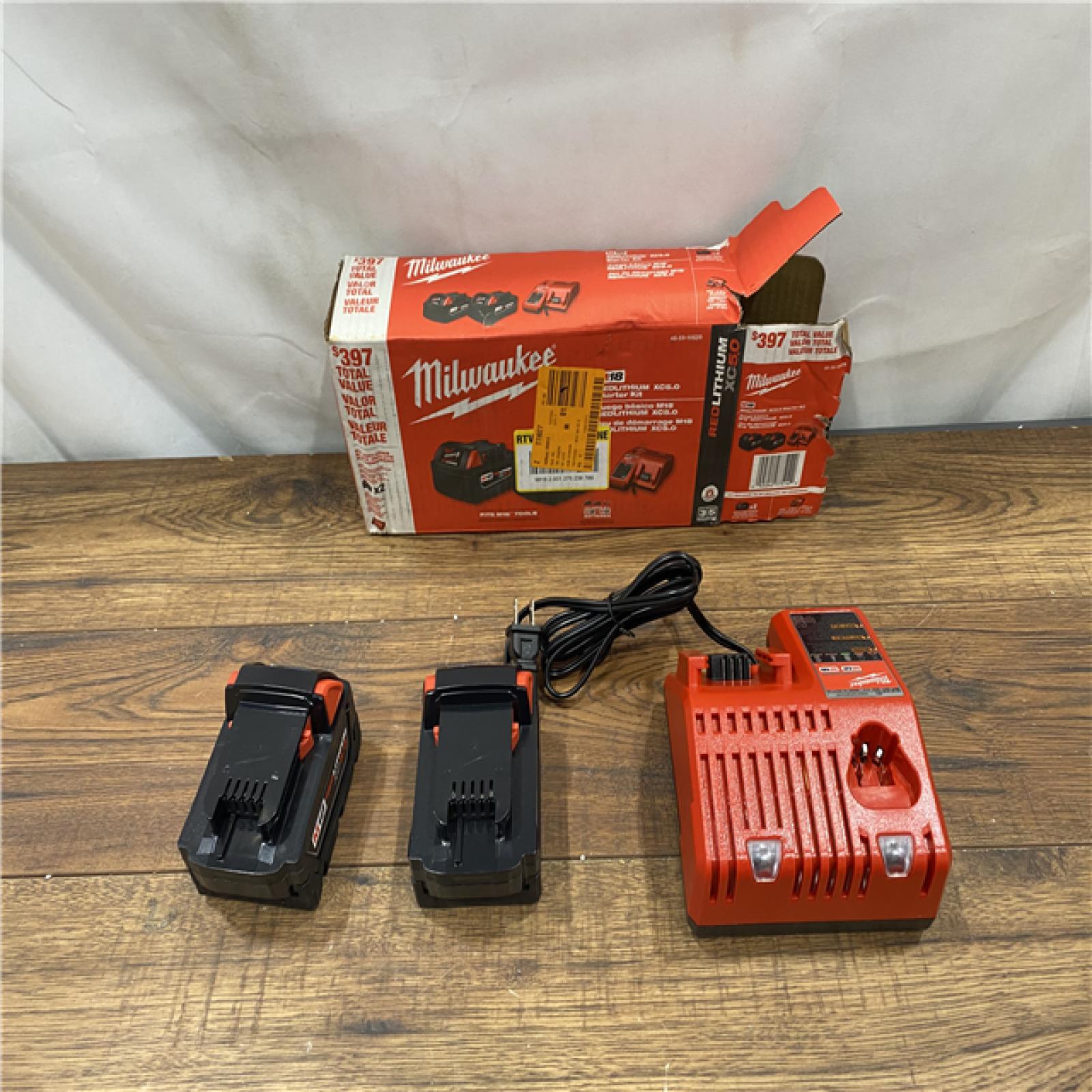 AS IS M18 18-Volt Lithium-Ion XC Starter Kit with Two 5.0Ah Batteries and Charger