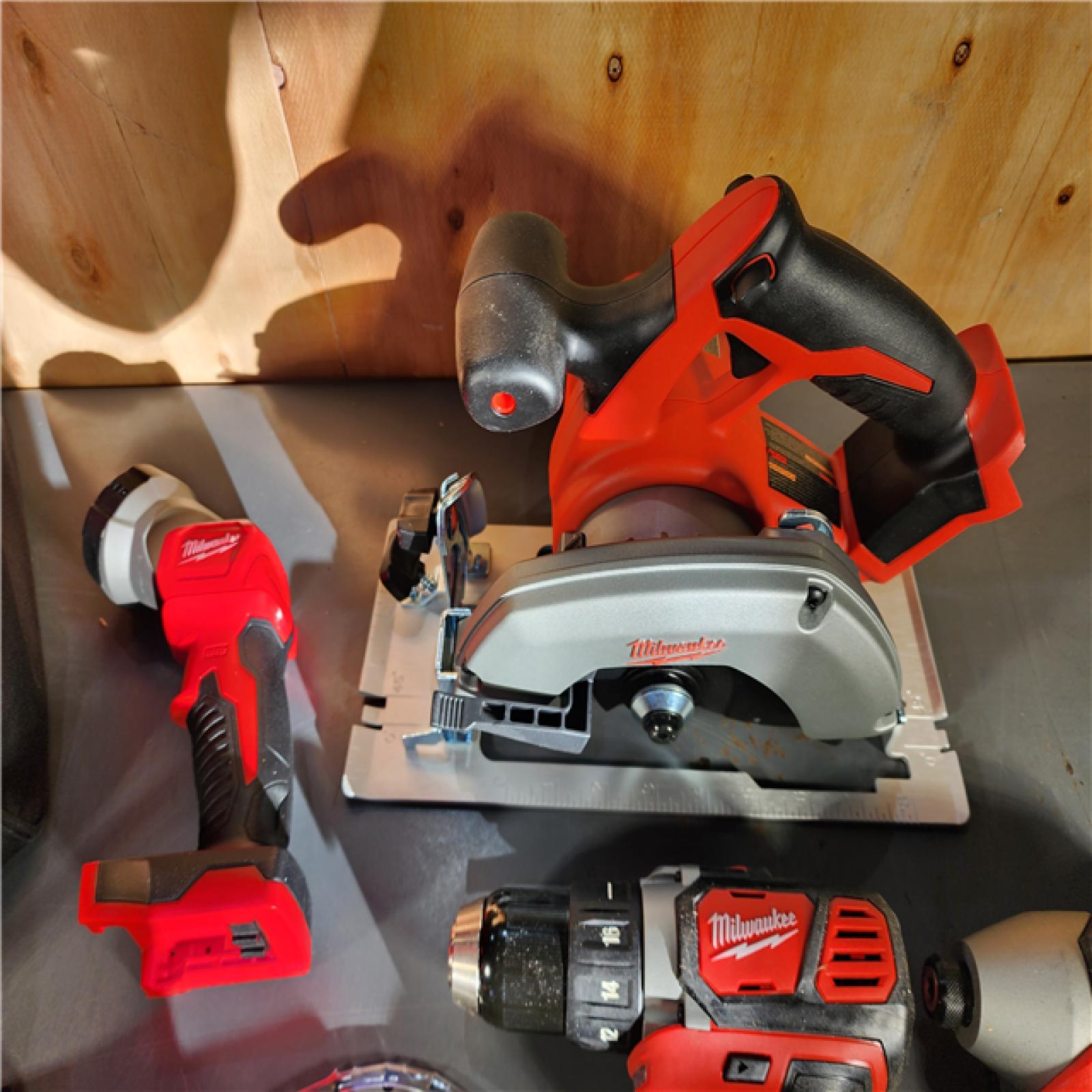 HOUSTON LOCATION - AS-IS Milwaukee M18 18-Volt Lithium-Ion Cordless Combo Tool Kit (5-Tool) with (1) 3.0Ah and (1) 1.5Ah Battery, (1) Charger, (1) Tool Bag