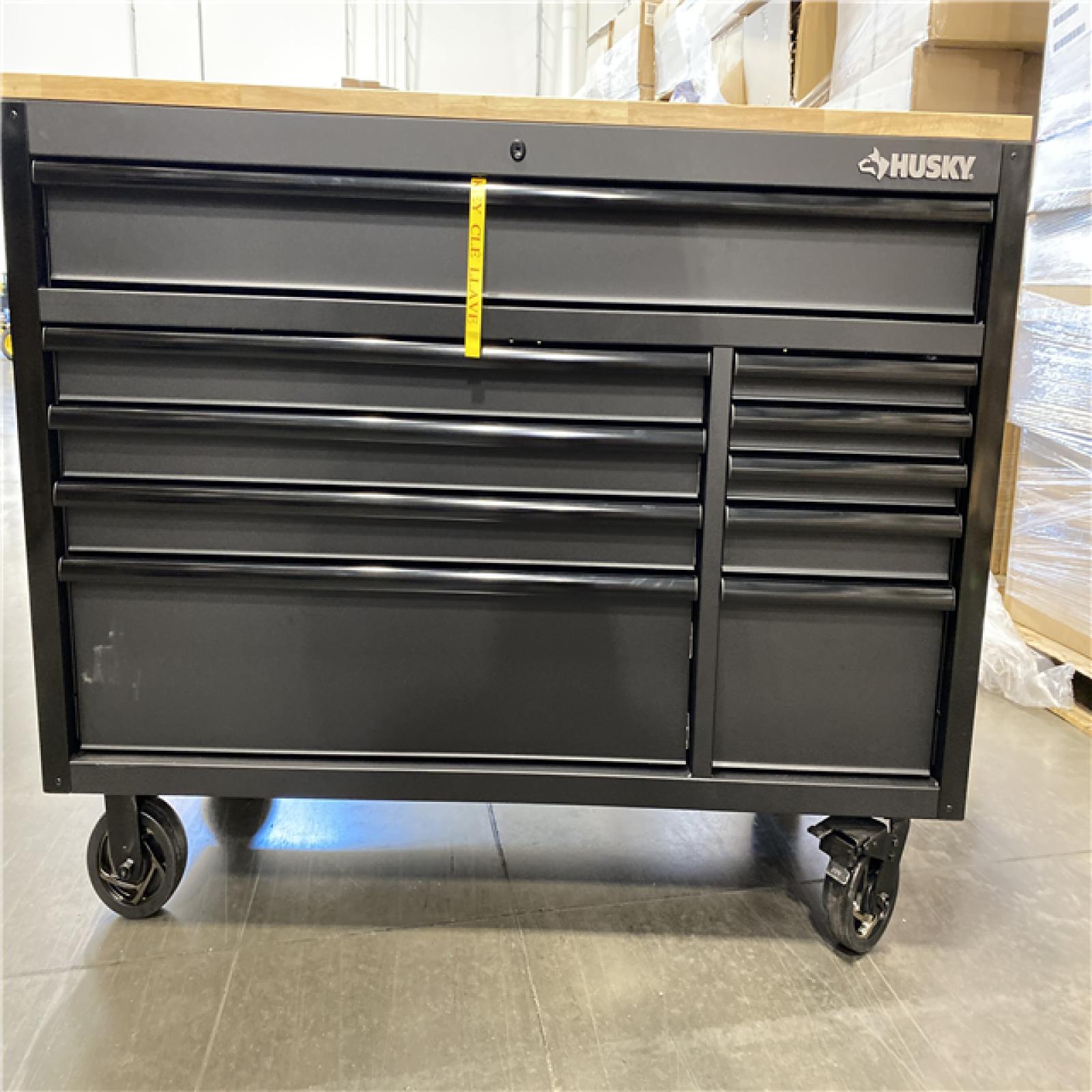 DALLAS LOCATION -Husky 56 in. W x 27.6 in. D 10-Drawer Matte Black Heavy-Duty Mobile Workbench with Pegboard and Top Cabinets