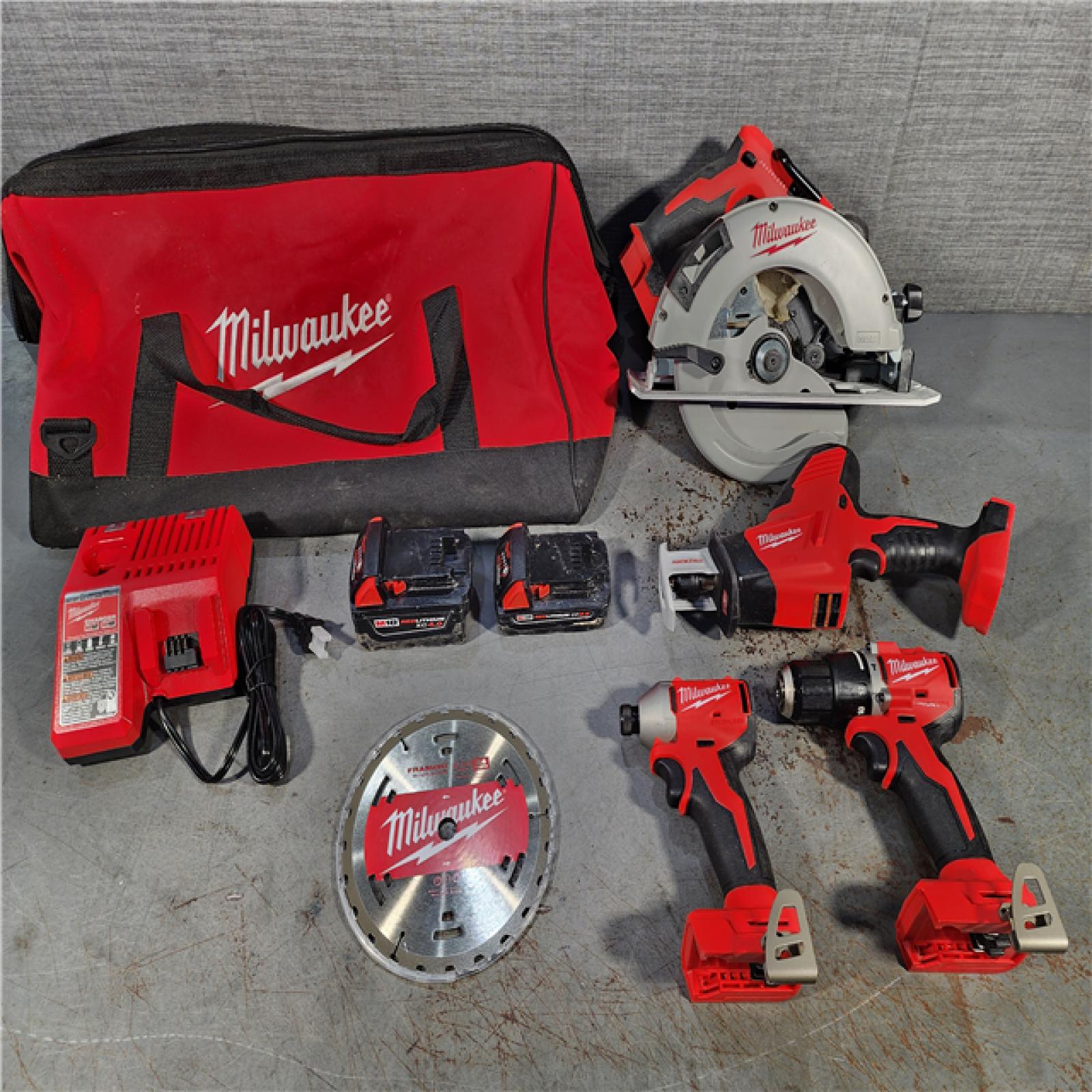 HOUSTON LOCATION - AS-IS Milwaukee M18 18-Volt Lithium-Ion Brushless Cordless Combo Kit (4-Tool) with 2-Batteries, 1-Charger and Tool Bag