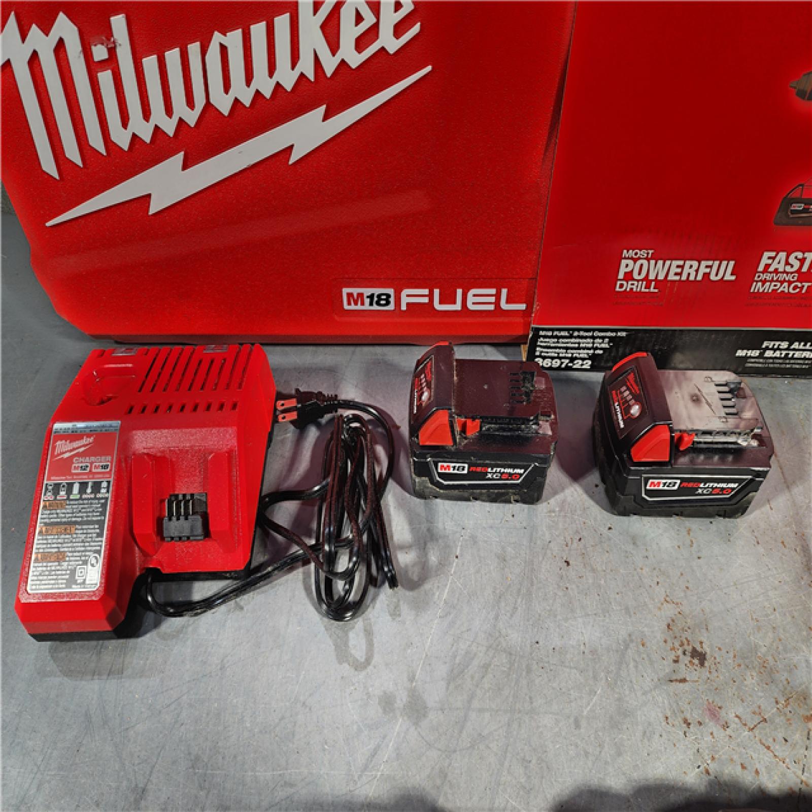 HOUSTON LOCATION - AS-IS Milwaukee M18 FUEL 18V Lithium-Ion Brushless Cordless Hammer Drill and Impact Driver Combo Kit (2-Tool) with 2 Batteries