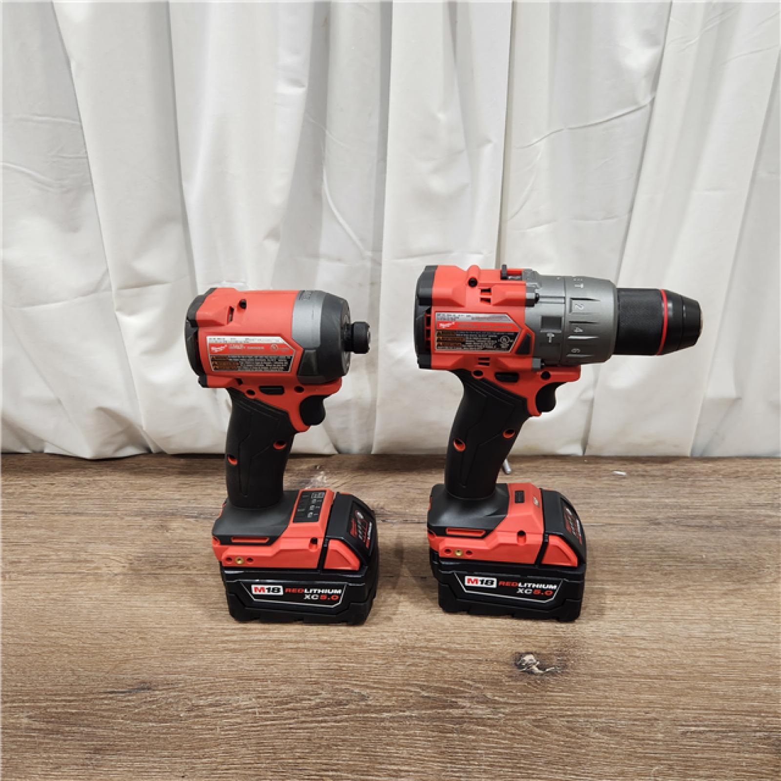 AS-IS Milwaukee M18 FUEL 18V Lithium-Ion Brushless Cordless Hammer Drill and Impact Driver Combo Kit (2-Tool) with 2 Batteries