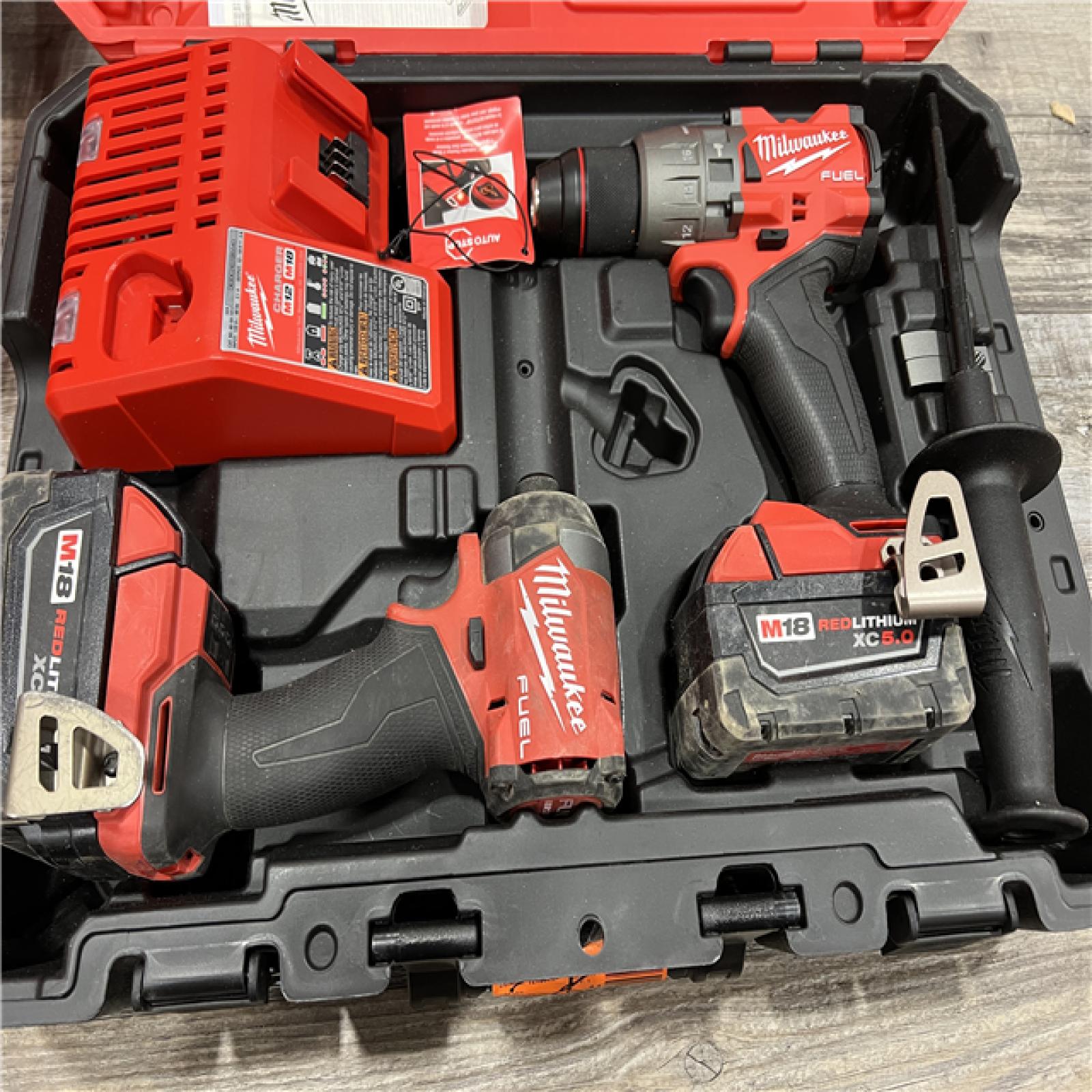 AS-IS Milwaukee M18 FUEL 18V Lithium-Ion Brushless Cordless Hammer Drill and Impact Driver Combo Kit (2-Tool) with 2 Batteries