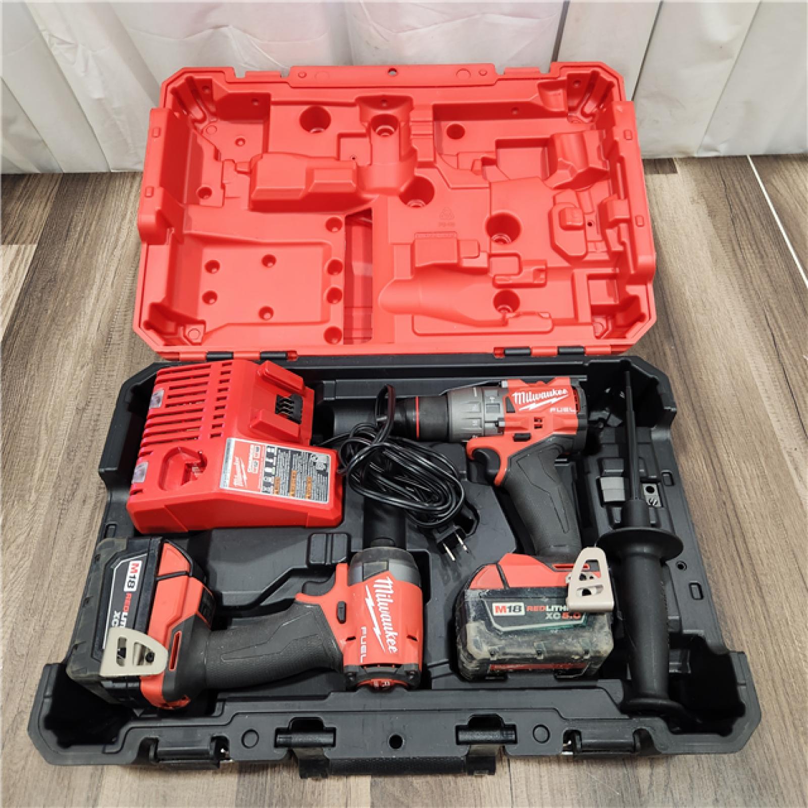 AS IS MIKWAUKEE M18 FUEL 18V Lithium-Ion Brushless Cordless Hammer Drill and Impact Driver Combo Kit (2-Tool) with 2 Batteries