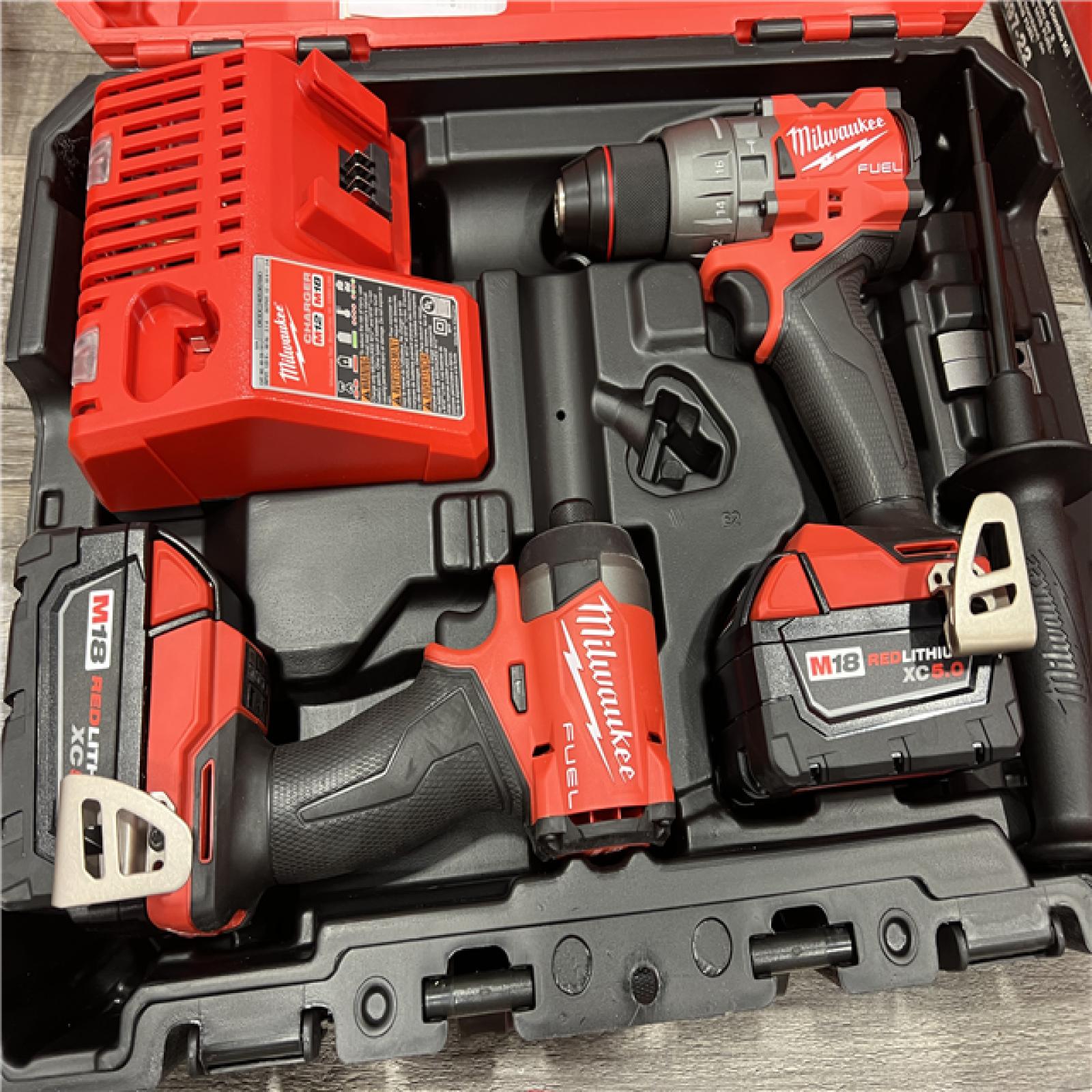 AS-IS MILWAUKEE M18 FUEL 18V Lithium-Ion Brushless Cordless Hammer Drill and Impact Driver Combo Kit (2-Tool) with 2 Batteries