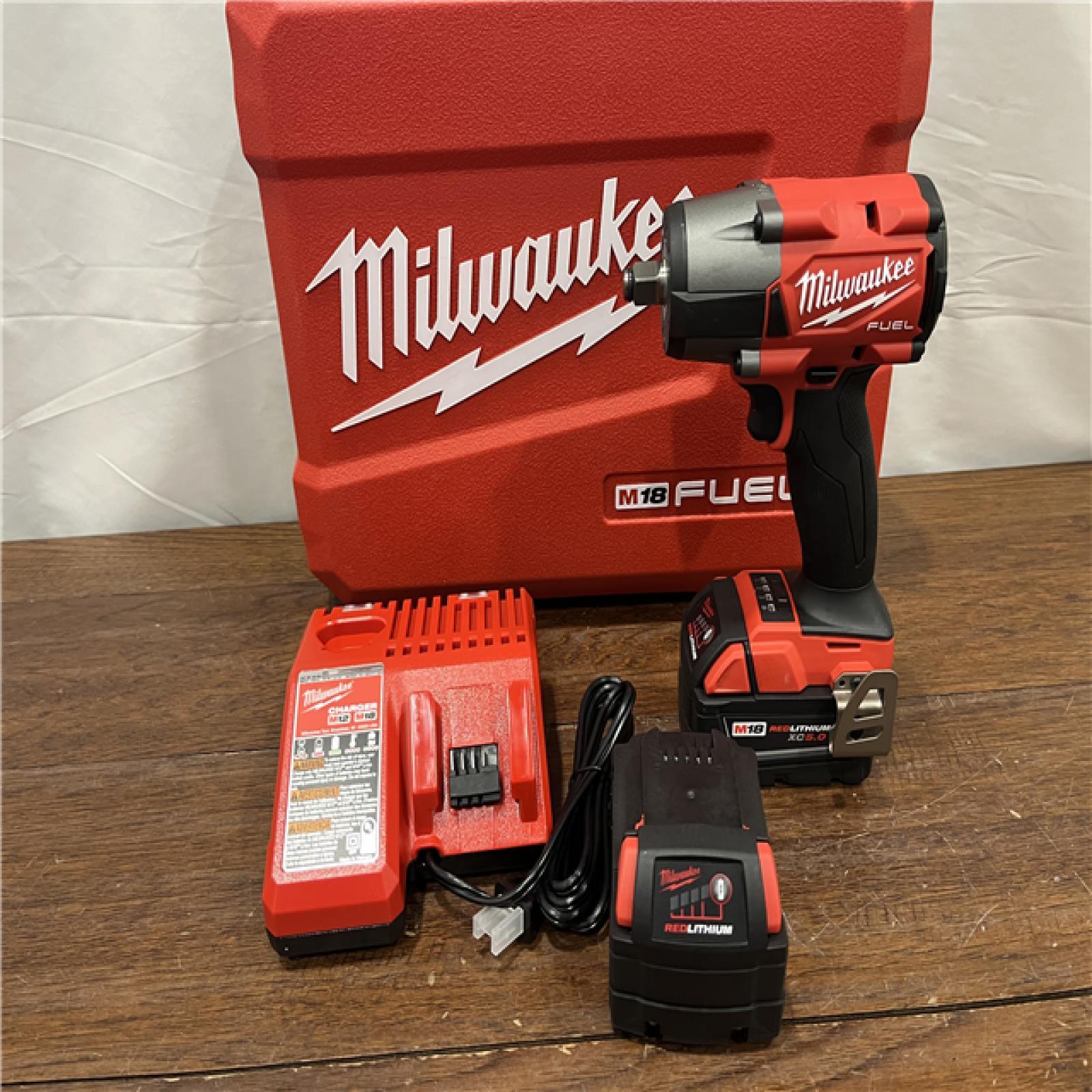 AS-ISMilwaukee M18 FUEL 1/2 in. Cordless Brushless Mid-Torque Impact Wrench Kit (Battery & Charger)