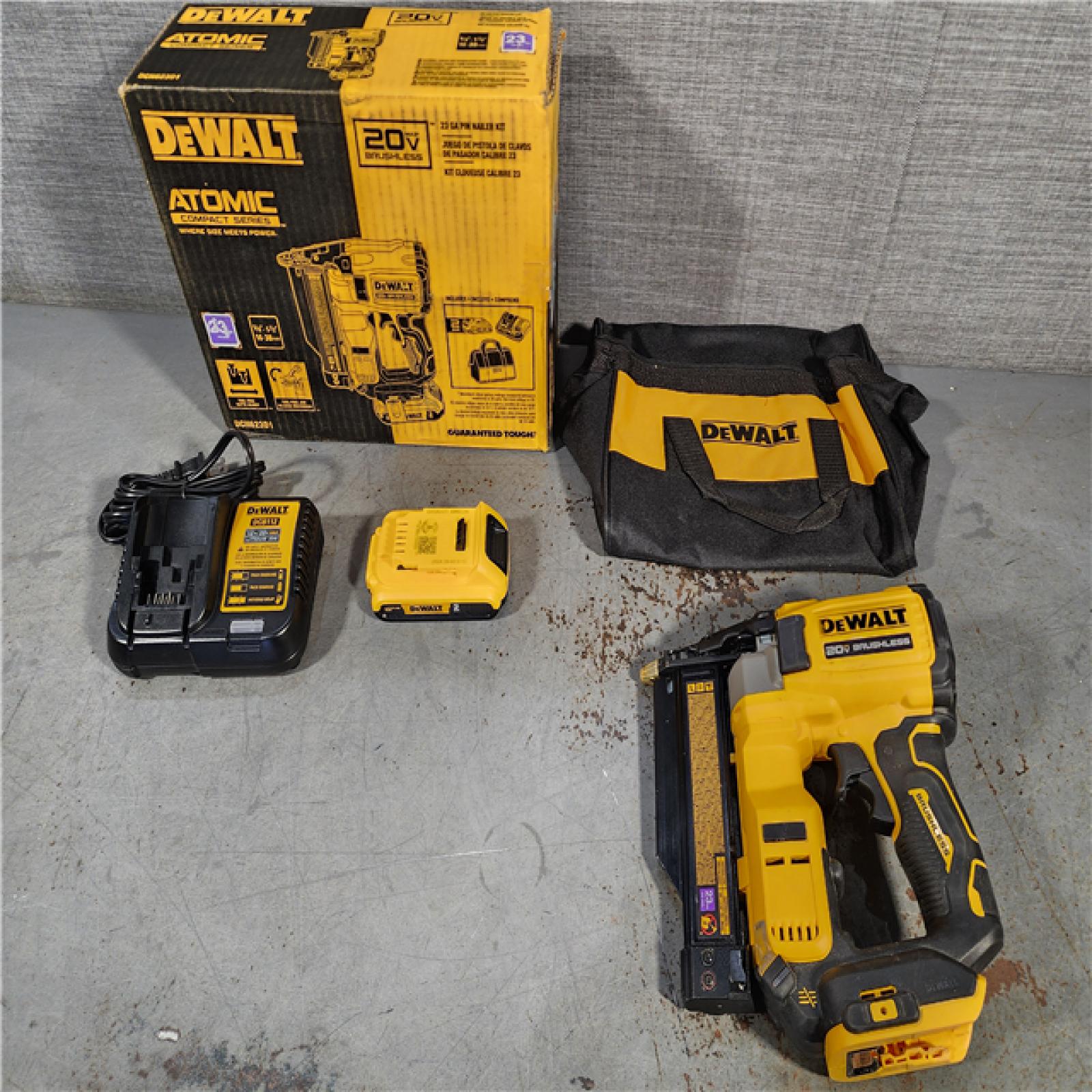 HOUSTON LOCATION - AS-IS DEWALT ATOMIC 20V MAX Lithium Ion Cordless 23 Gauge Pin Nailer Kit with 2.0Ah Battery and Charger