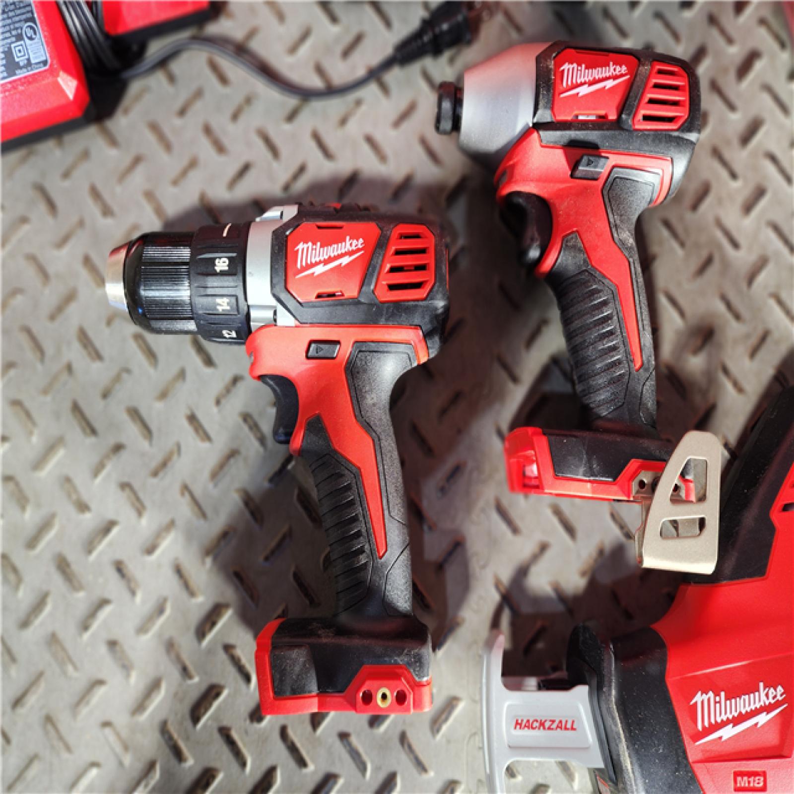 HOUSTON LOCATION - AS-IS Milwaukee M18 18-Volt Lithium-Ion Cordless Combo Tool Kit (5-Tool) with (1) 3.0Ah and (1) 1.5Ah Battery, (1) Charger, (1) Tool Bag