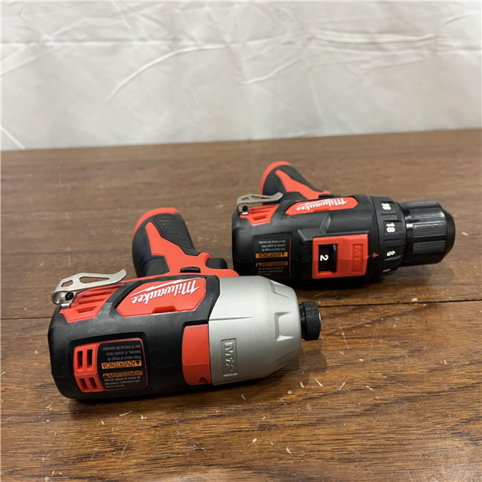 AS-IS Milwaukee 2494-22 M12 Cordless Combination 3/8  Drill / Driver and 1/4  Hex Impact Driver Dual Power Tool Kit (2 Lithium Ion Batteries  Charger  and B