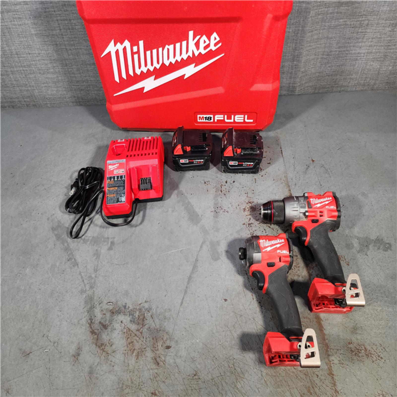 HOUSTON LOCATION - AS-IS Milwaukee M18 FUEL 18V Lithium-Ion Brushless Cordless Hammer Drill and Impact Driver Combo Kit (2-Tool) with 2 Batteries