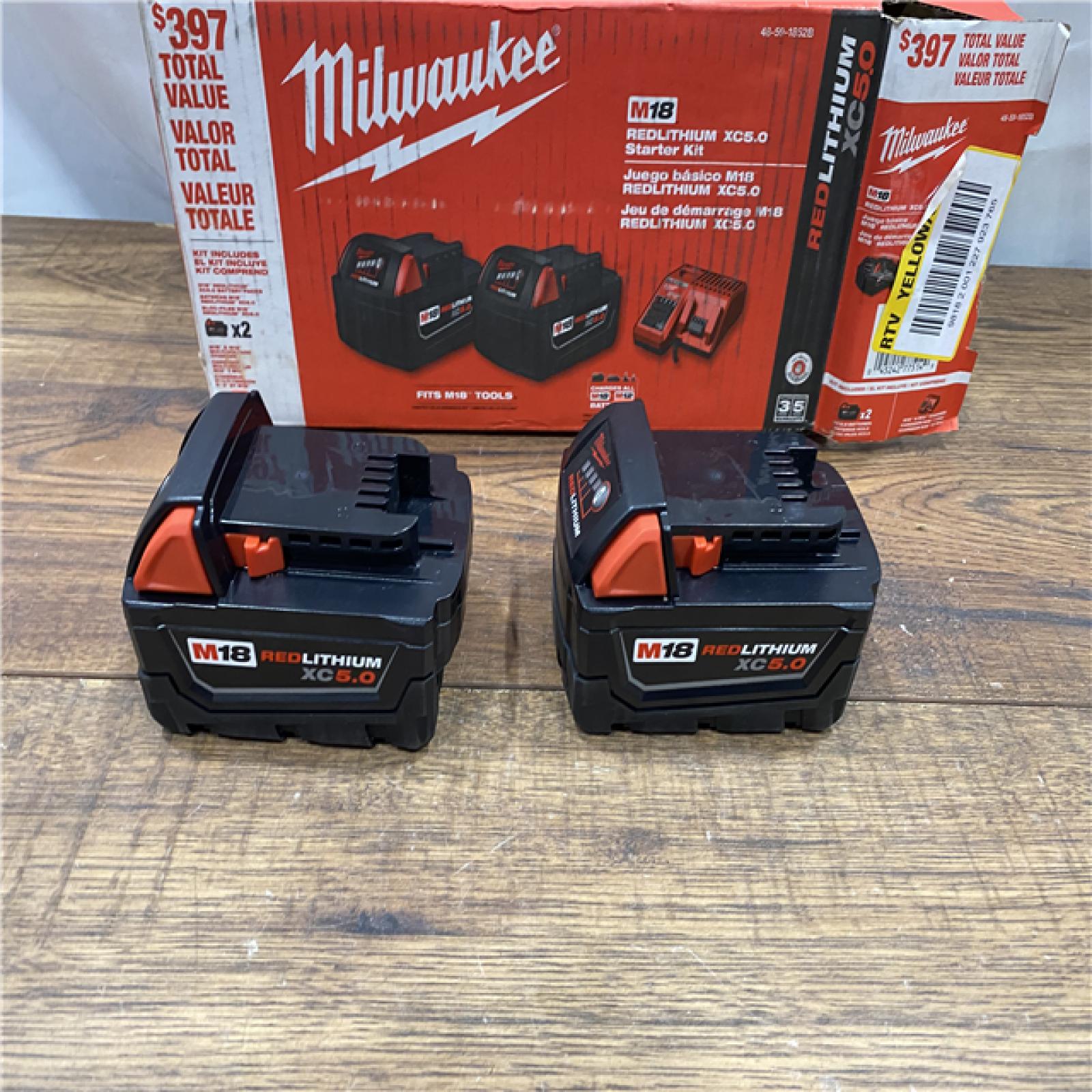 AS IS Milwaukee M18 18-Volt Lithium-Ion XC Starter Kit with Two 5.0Ah Batteries / Charger (48-59-1852B)