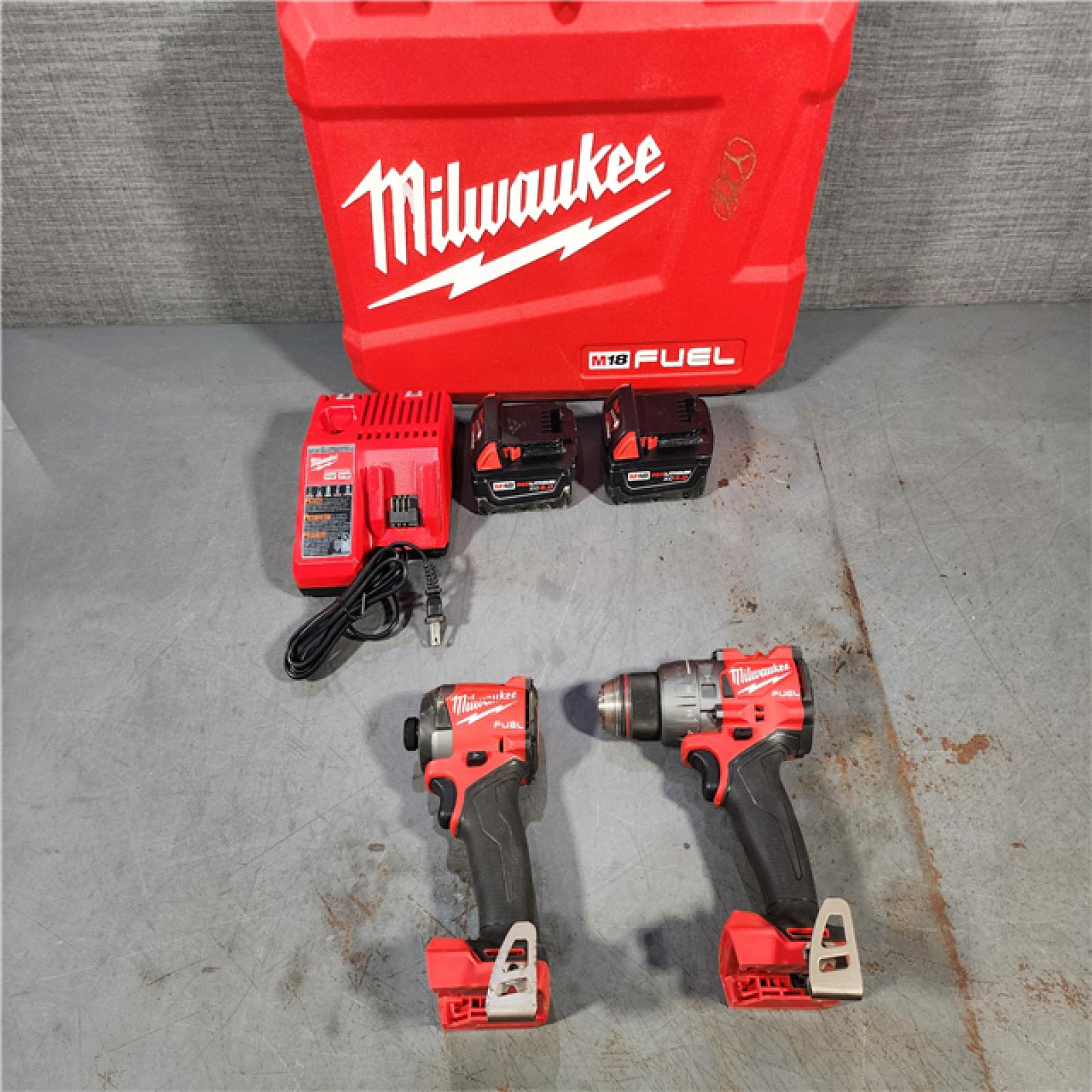 HOUSTON LOCATION - AS-IS Milwaukee M18 FUEL 18V Lithium-Ion Brushless Cordless Hammer Drill and Impact Driver Combo Kit (2-Tool) with 2 Batteries