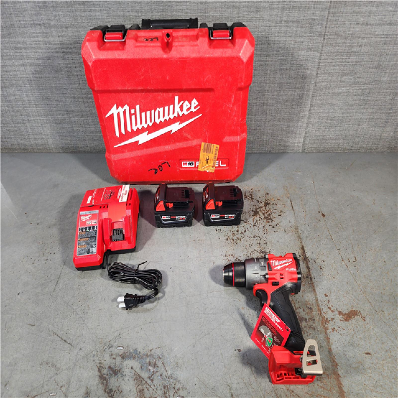 HOUSTON LOCATION - AS-IS (APPEARS LIKE NEW) Milwaukee 2904-22 Hammer Drill Driver Kit with Batteries  Charger & Tool Case  Red