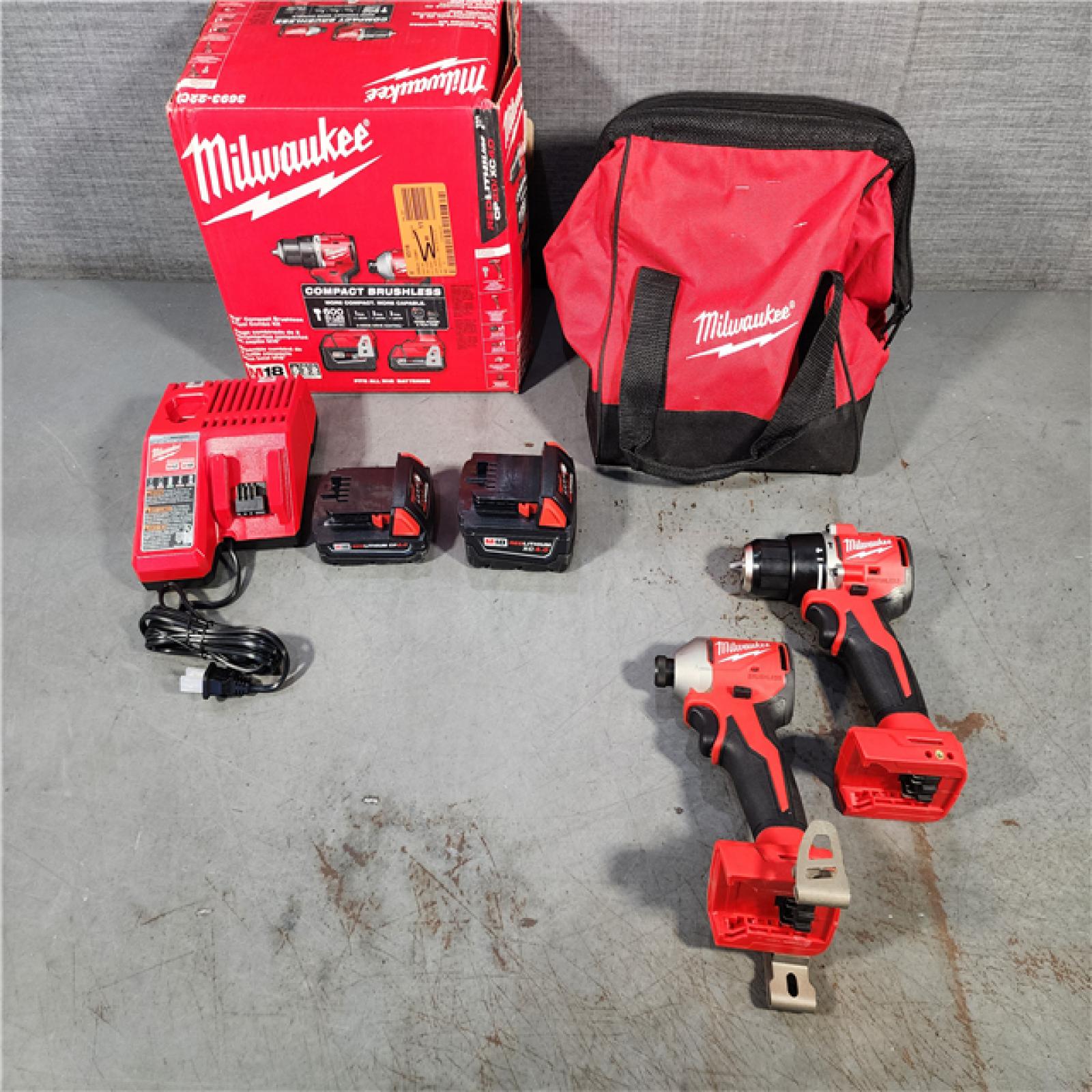 HOUSTON LOCATION - AS-IS M18 18-Volt Lithium-Ion Brushless Cordless Compact Hammer Drill/Impact Combo Kit (2-Tool) with (2) Batteries, Bag