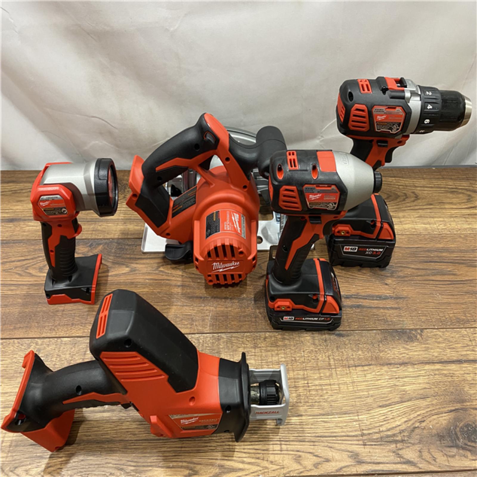 AS IS M18 18V Lithium-Ion Cordless Combo Kit (5-Tool) with (1) 3.0Ah and (1) 1.5Ah Battery, (1) Charger, (1) Tool Bag