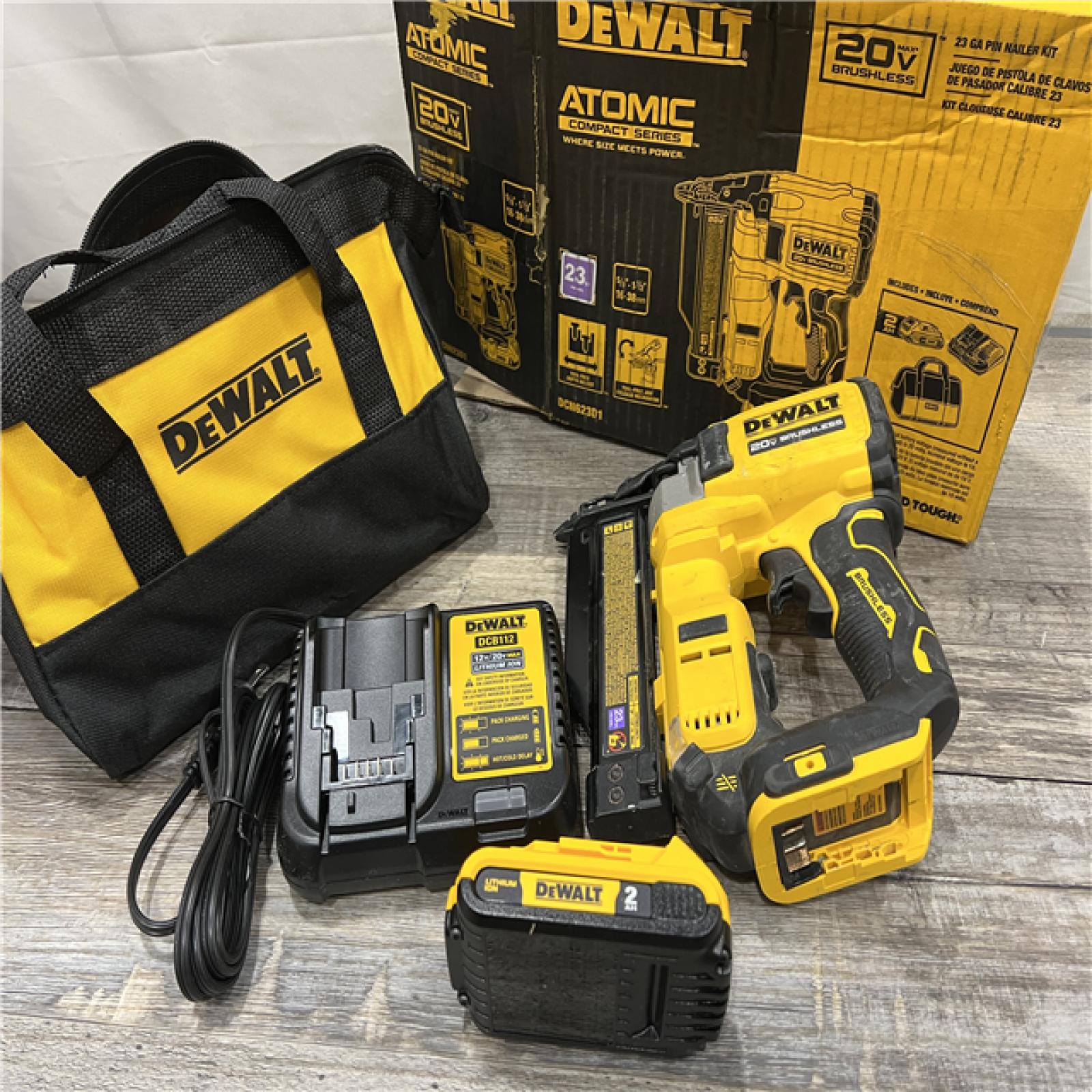 AS-IS DEWALT ATOMIC 20V MAX Lithium Ion Cordless 23 Gauge Pin Nailer Kit with 2.0Ah Battery and Charger