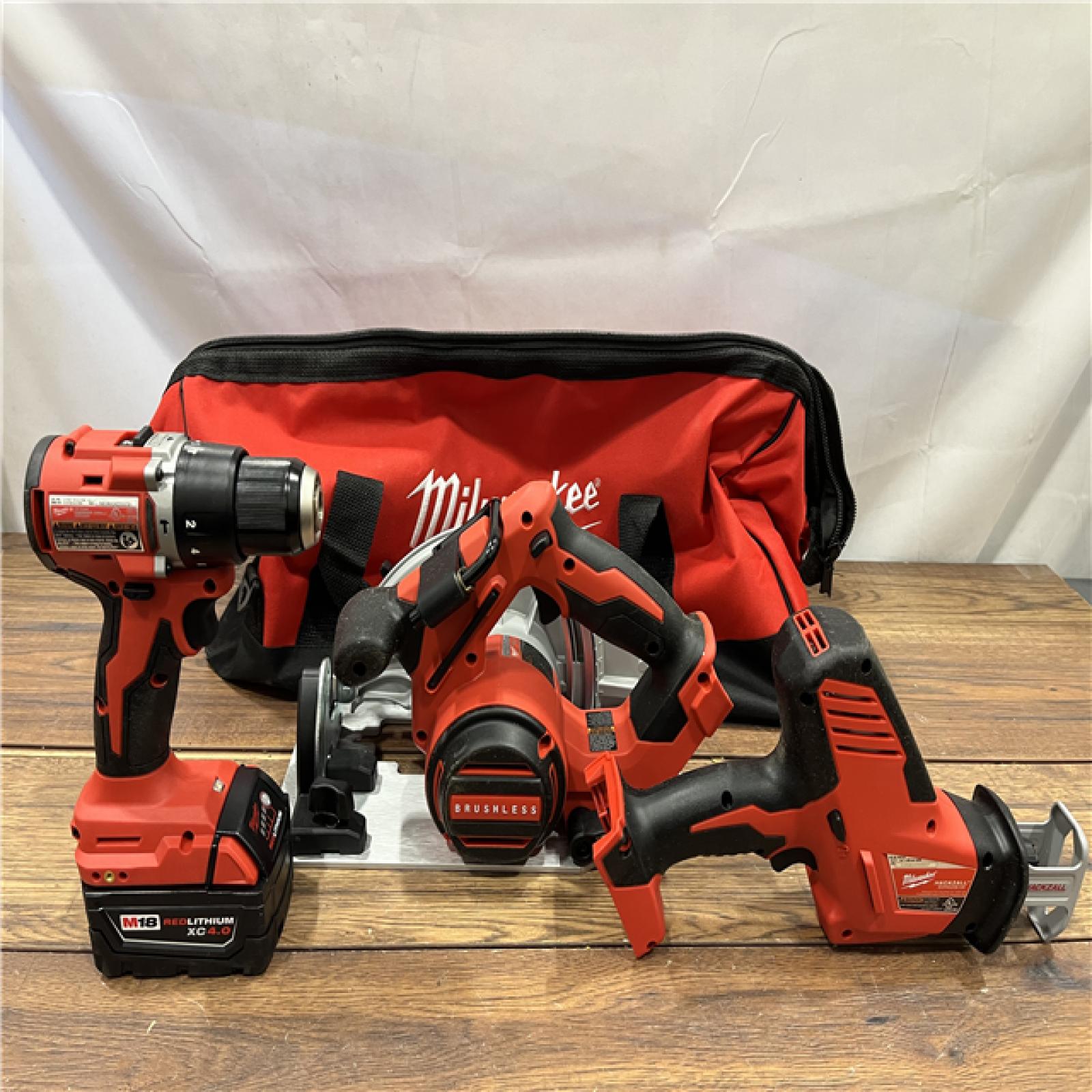 AS IS Milwaukee M18 18-Volt Lithium-Ion Brushless Cordless Combo Kit (4-Tool) with 2-Batteries, 1-Charger and Tool Bag