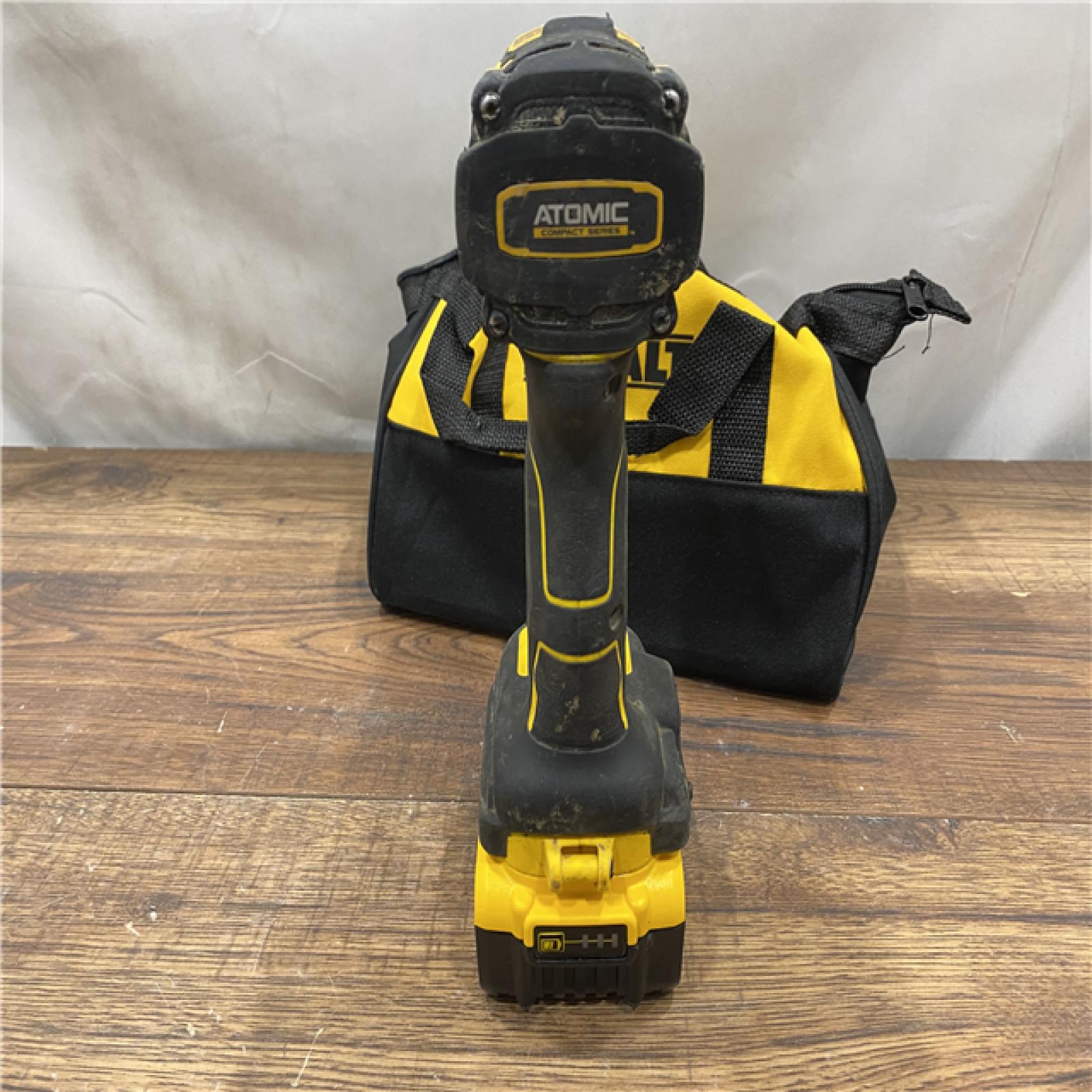 AS IS DEWALT ATOMIC 20V MAX Lithium-Ion Cordless 1/4 in. Brushless Impact Driver Kit, 5 Ah Battery, Charger, and Bag