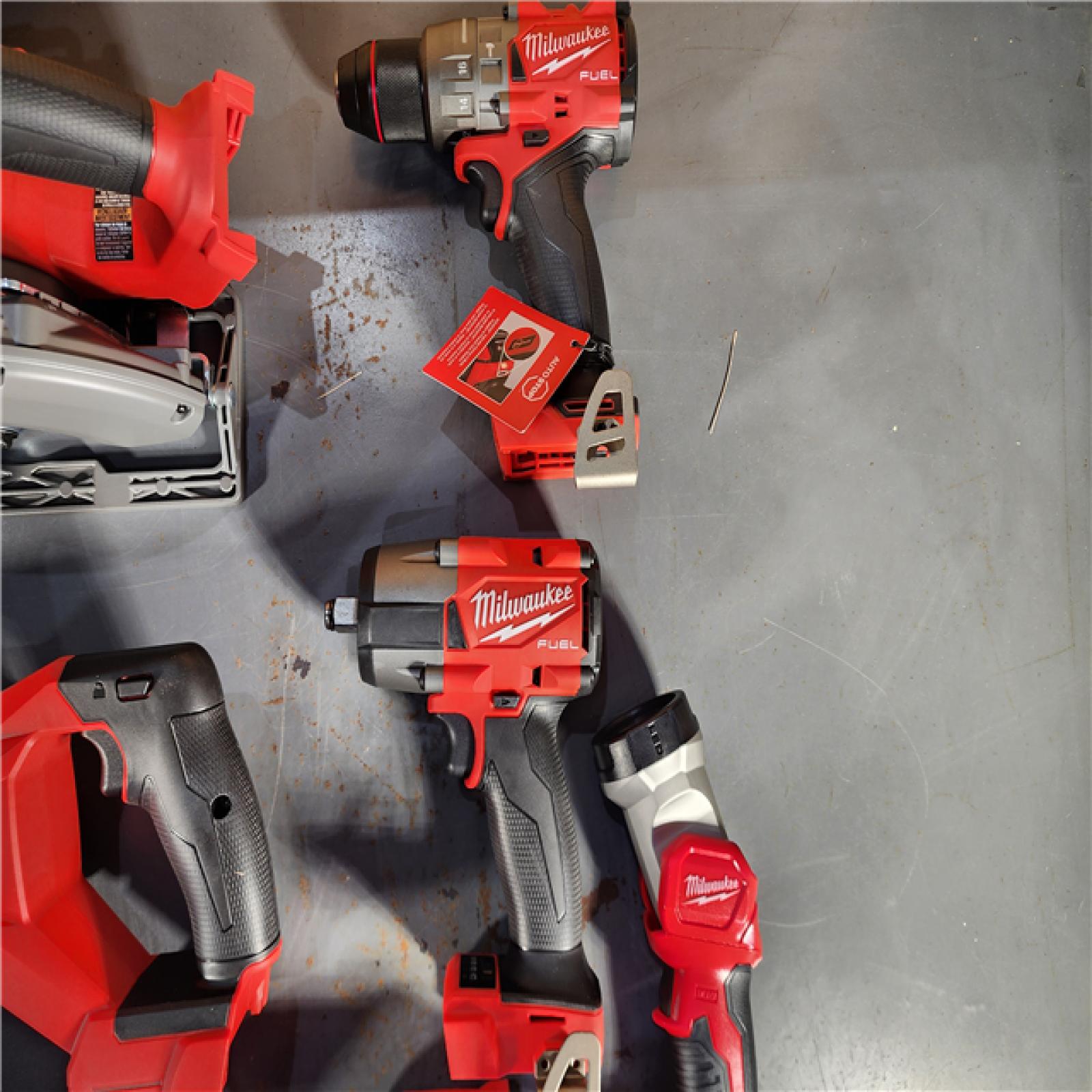 HOUSTON LOCATION - AS-IS (APPEARS LIKE NEW) Milwaukee M18 FUEL 18V Lithium-Ion Brushless Cordless Combo Kit with Two 5.0 Ah Batteries  1 Charger  2 Tool Bags (7-Tool)