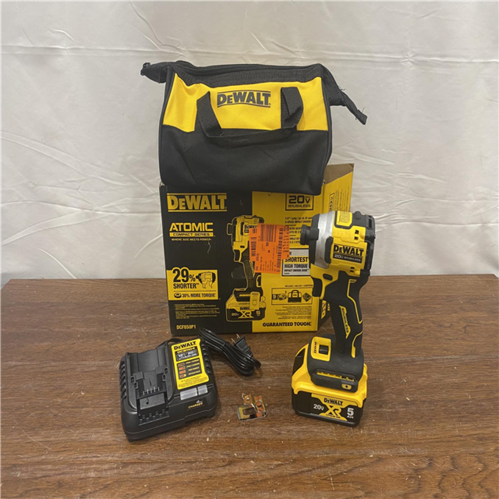 AS-IS DEWALT ATOMIC 20V MAX Lithium-Ion Cordless 1/4 in. Brushless Impact Driver Kit, 5 Ah Battery, Charger, and Bag