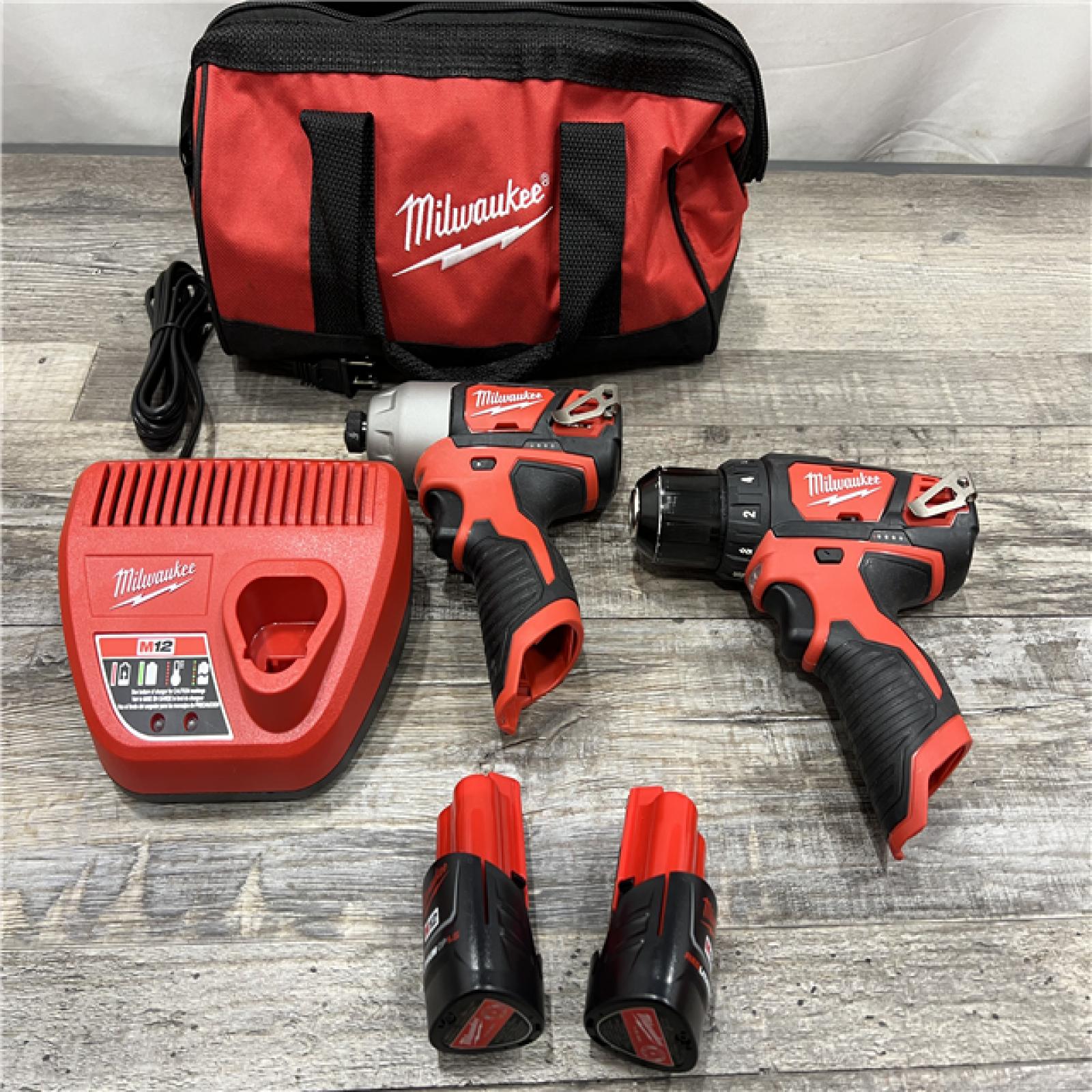 AS-IS Milwaukee 2494-22 M12 Cordless Combination 3/8  Drill / Driver and 1/4  Hex Impact Driver Dual Power Tool Kit (2 Lithium Ion Batteries  Charger  and B