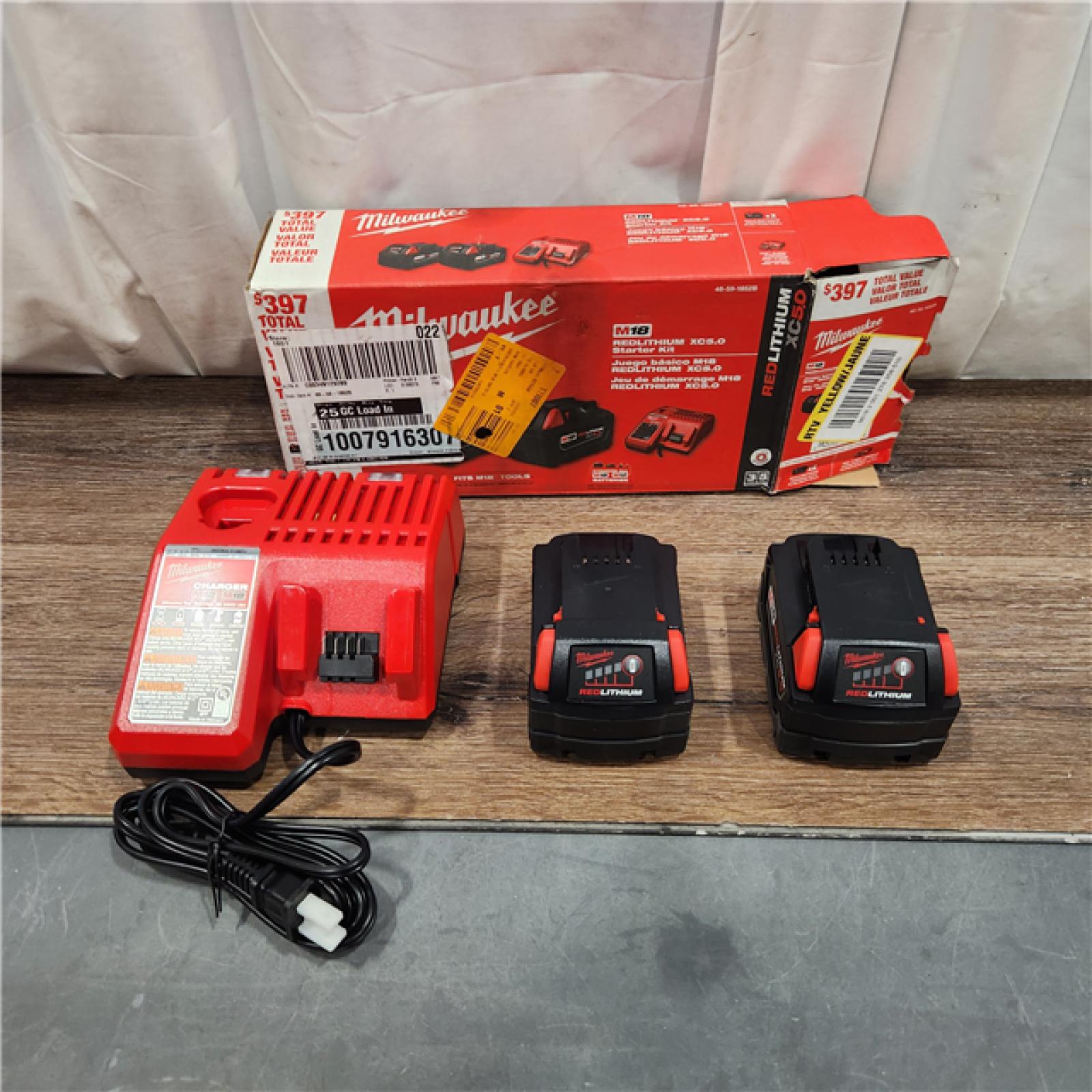 AS IS M18 18-Volt Lithium-Ion XC Starter Kit with Two 5.0Ah Batteries and Charger