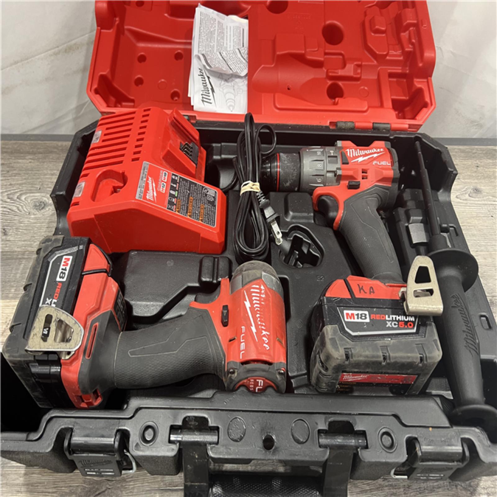 AS-IS MILWAUKEE M18 FUEL 18V Lithium-Ion Brushless Cordless Hammer Drill and Impact Driver Combo Kit (2-Tool) with 2 Batteries