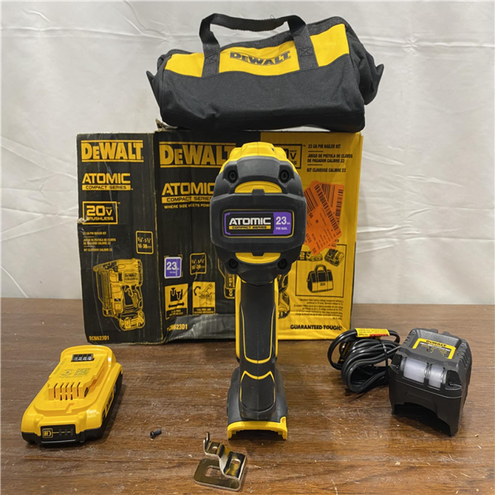 AS-IS DEWALT ATOMIC 20V MAX Lithium Ion Cordless 23 Gauge Pin Nailer Kit with 3.0Ah Battery and Charger