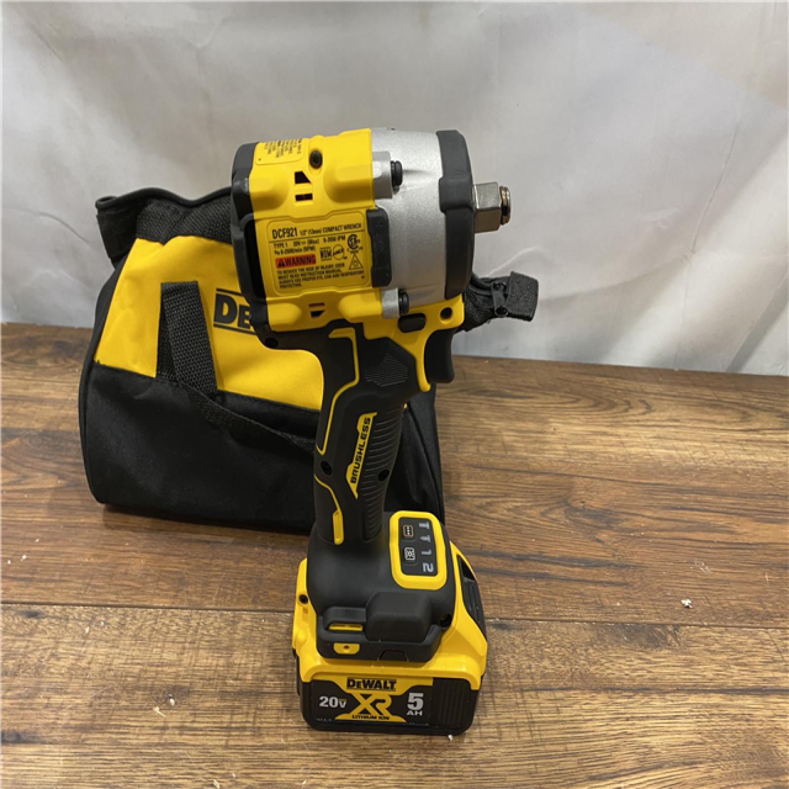 AS IS DEWALT ATOMIC 20V MAX Lithium-Ion Brushless Cordless 1/2 in. Variable Speed Impact Wrench Kit with 5 Ah Battery and Charger