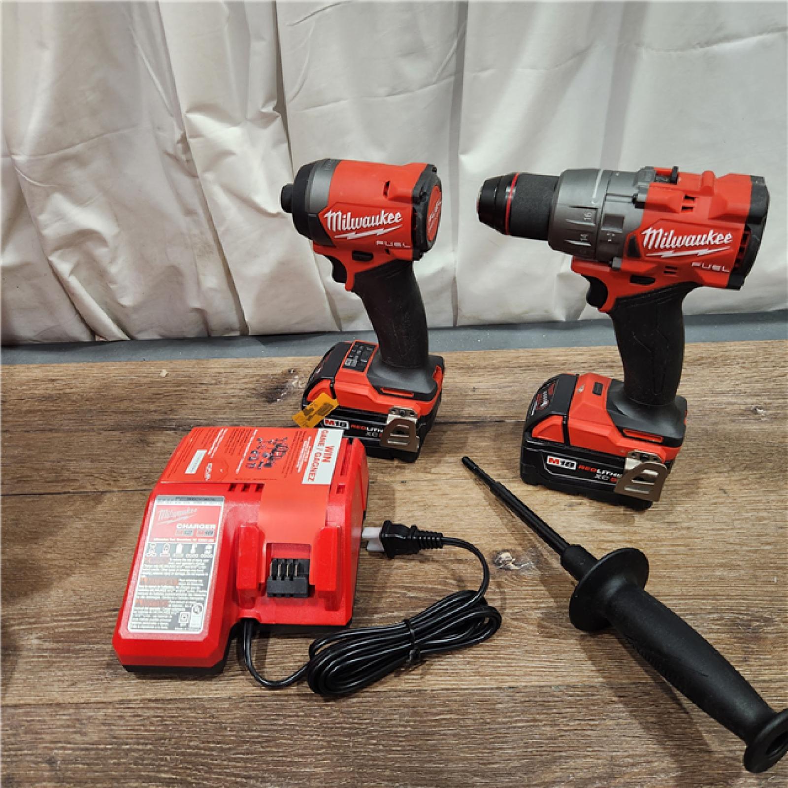 AS-IS Milwaukee M18 FUEL 18V Lithium-Ion Brushless Cordless Hammer Drill and Impact Driver Combo Kit (2-Tool) with 2 Batteries