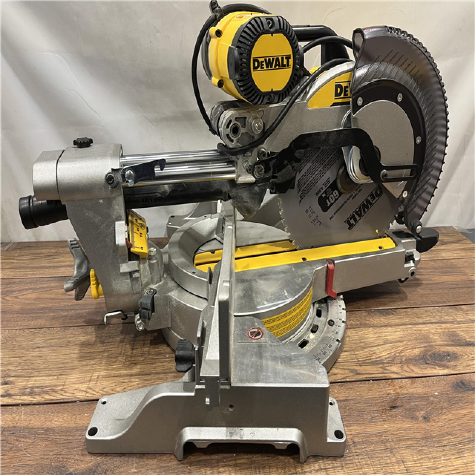 AS IS DEWALT 15 Amp Corded 12 in. Double Bevel Sliding Compound Miter Saw with XPS Technology, Blade Wrench and Material Clamp