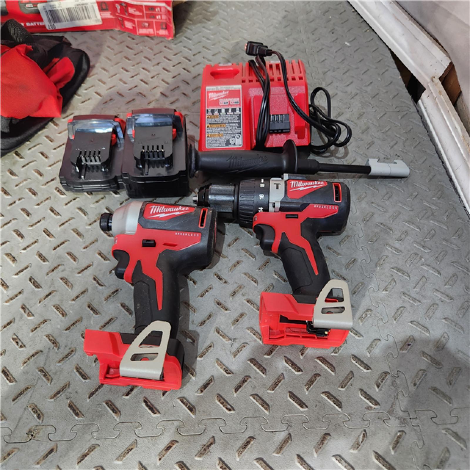 Houston location AS-IS MILWAUKEE M18 18V Lithium-Ion Brushless Cordless Hammer Drill/Impact Combo Kit (2-Tool) with 2 Batteries, Charger and Bag