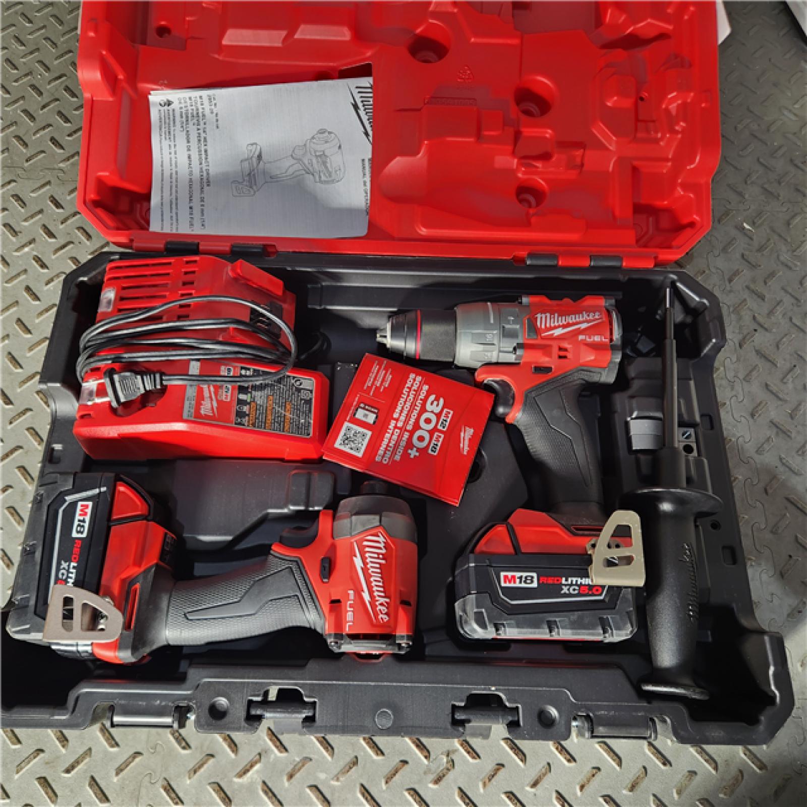 Houston location AS-IS Milwaukee 3697-22 M18 FUEL 1/2 Hammer Driller/Driver &1/4 Hex Impact Driver 2 Tool Combo Kit