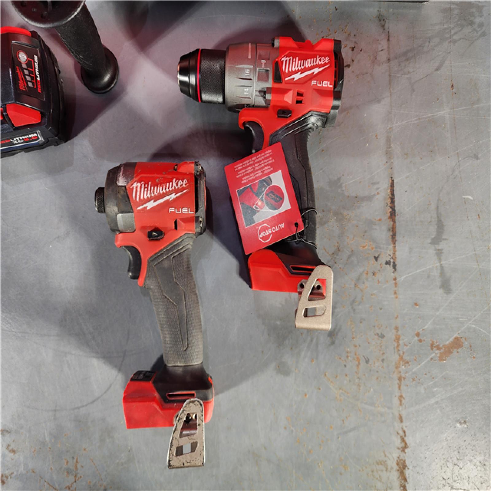 HOUSTON LOCATION - AS-IS Milwaukee M18 FUEL 18V Lithium-Ion Brushless Cordless Hammer Drill and Impact Driver Combo Kit (2-Tool) with 2 Batteries