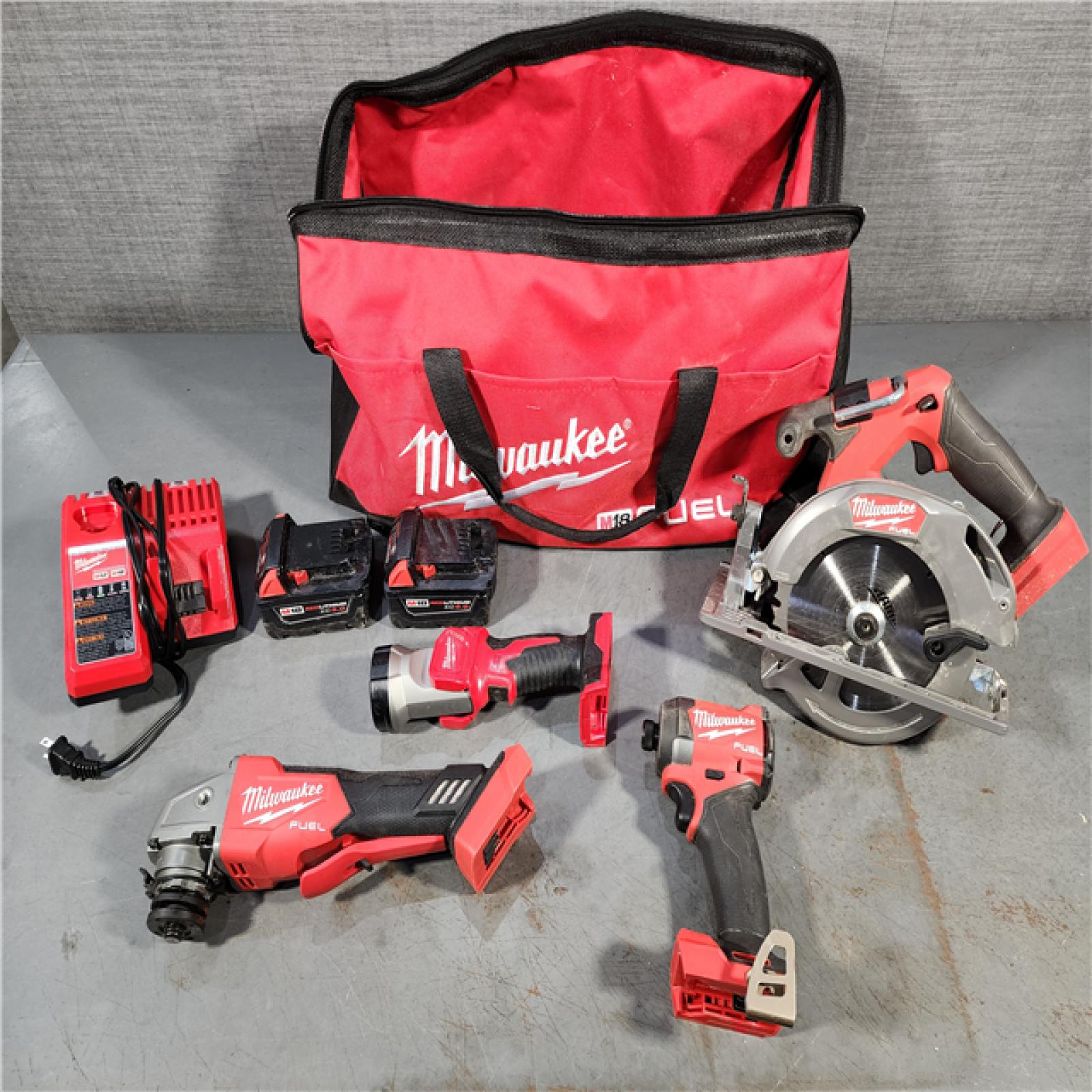 HOUSTON LOCATION - AS-IS MILWAUKEE 4 TOOL COMBO KIT W/ (2) BATTERY & CHARGER