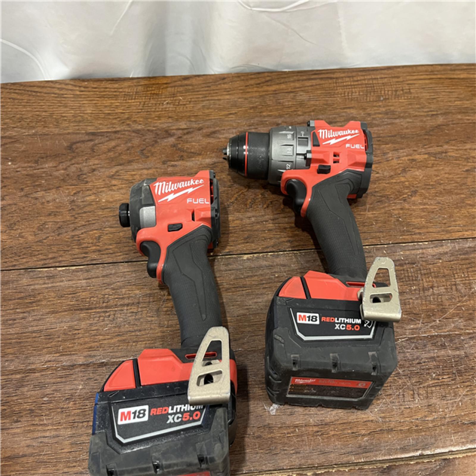 AS-ISMilwaukee M18 FUEL 18V Lithium-Ion Brushless Cordless Hammer Drill and Impact Driver Combo Kit (2-Tool) with 2 Batteries