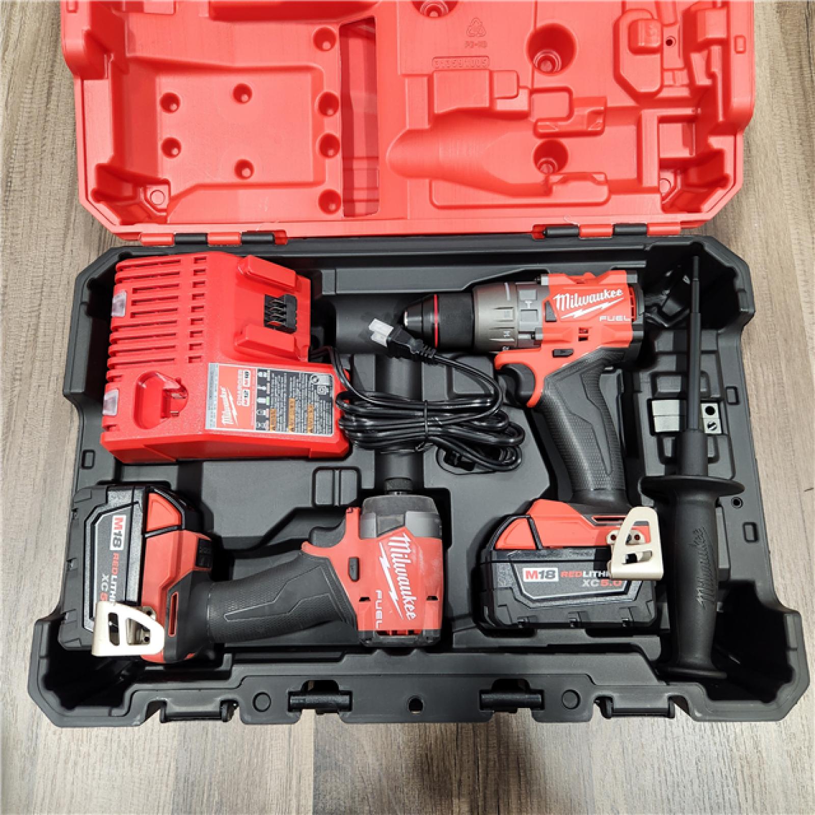 AS IS Milwaukee M18 FUEL 18V Lithium-Ion Brushless Cordless Hammer Drill and Impact Driver Combo Kit (2-Tool) with 2 Batteries