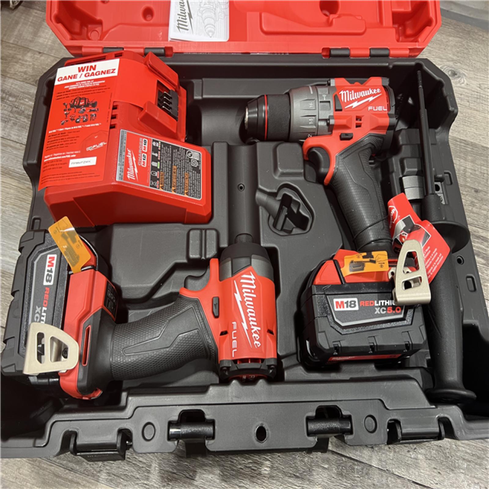 AS-IS MILWAUKEE M18 FUEL 18V Lithium-Ion Brushless Cordless Hammer Drill and Impact Driver Combo Kit (2-Tool) with 2 Batteries