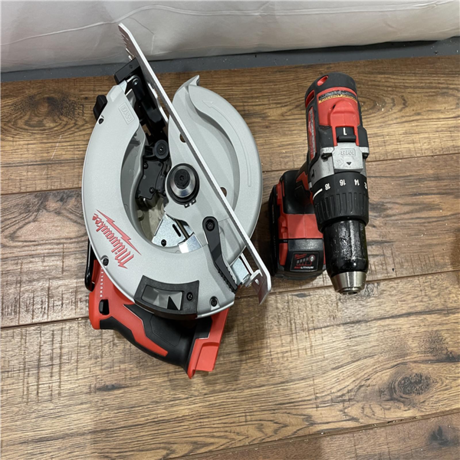 AS-IS Milwaukee M18 18V Lithium-Ion Brushless Cordless Hammer Drill and Circular Saw Combo Kit (2-Tool) with Two 4.0 Ah Batteries