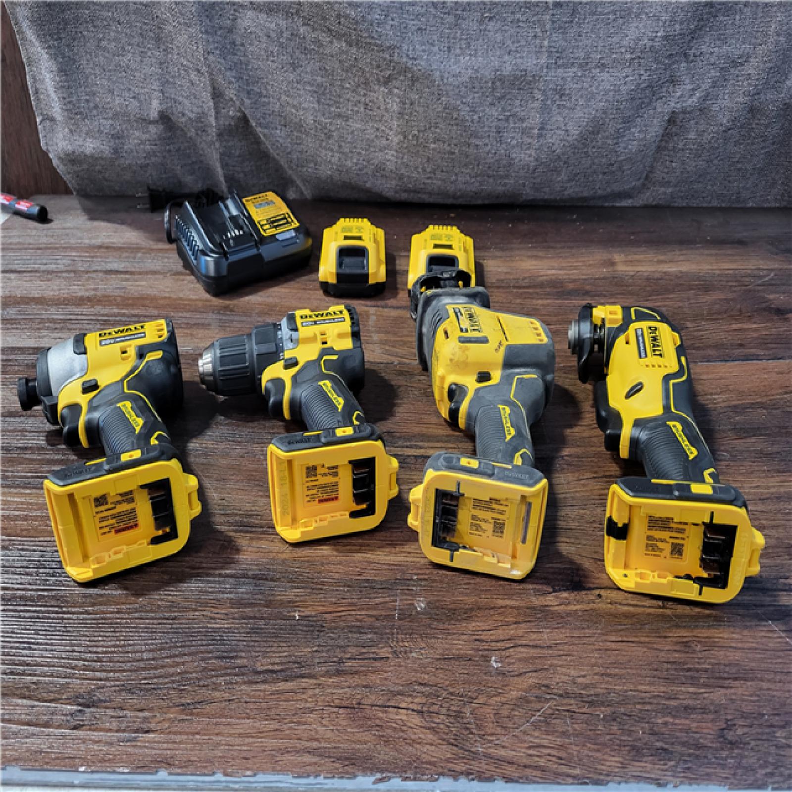 CALIFORNIA AS-IS DEWALT BRUSHLESS 4-TOOL COMBO KIT(BATTERIES,CHARGER,AND BAG INCLUDED)