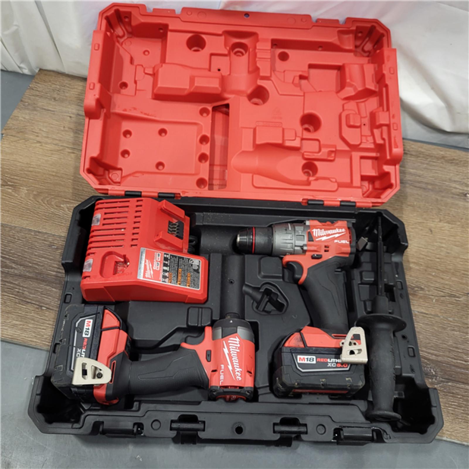 AS-IS Milwaukee M18 FUEL 18V Lithium-Ion Brushless Cordless Hammer Drill and Impact Driver Combo Kit (2-Tool) with 2 Batteries