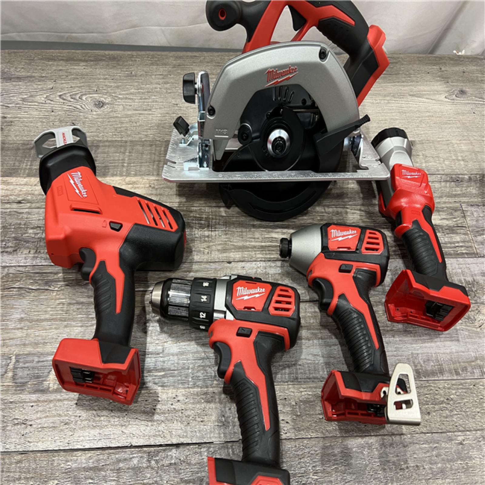 AS-IS MILWAUKEE M18 18V Lithium-Ion Cordless Combo Kit (5-Tool) with (1) 3.0Ah and (1) 1.5Ah Battery, (1) Charger, (1) Tool Bag