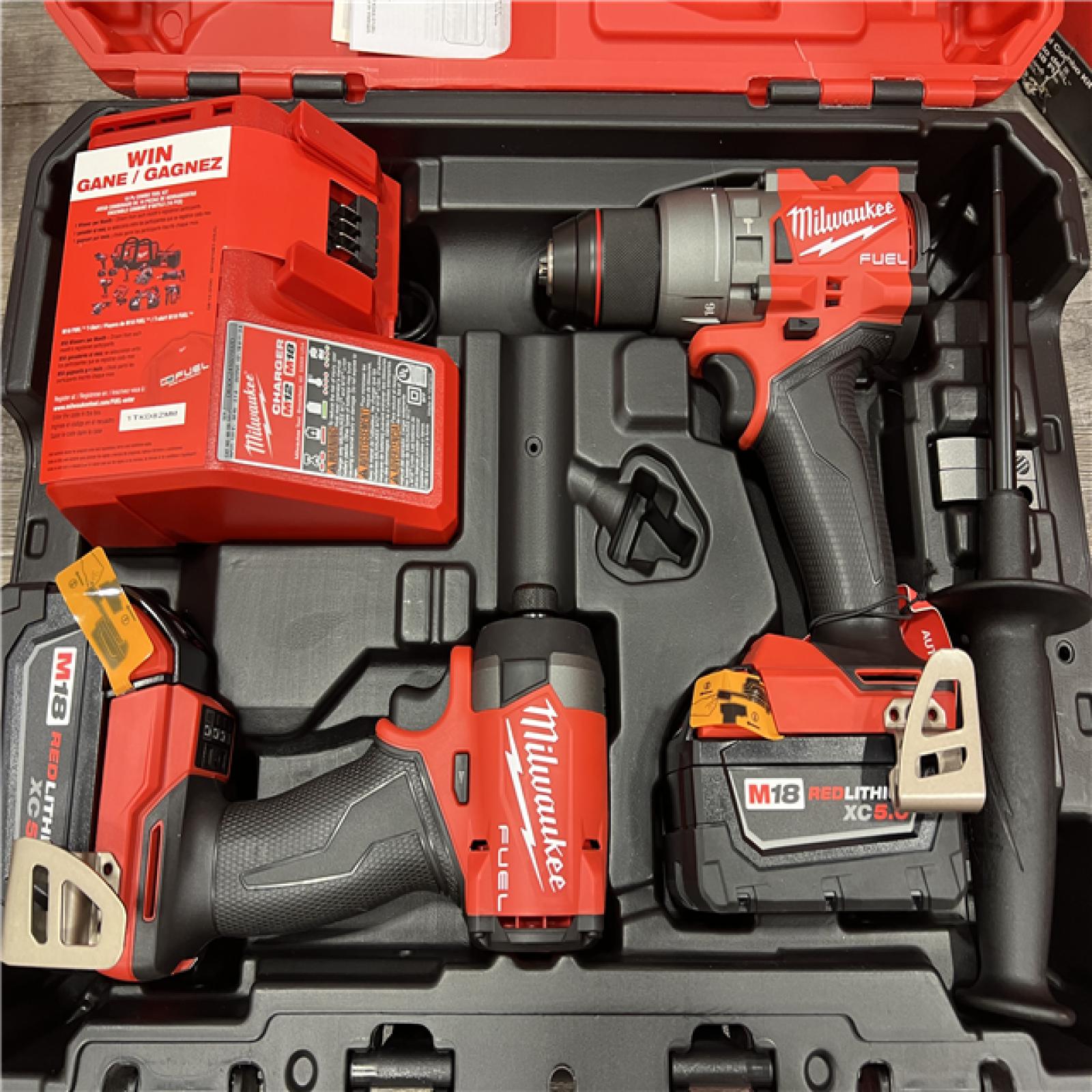 AS-IS MILWAUKEE M18 FUEL 18V Lithium-Ion Brushless Cordless Hammer Drill and Impact Driver Combo Kit (2-Tool) with 2 Batteries